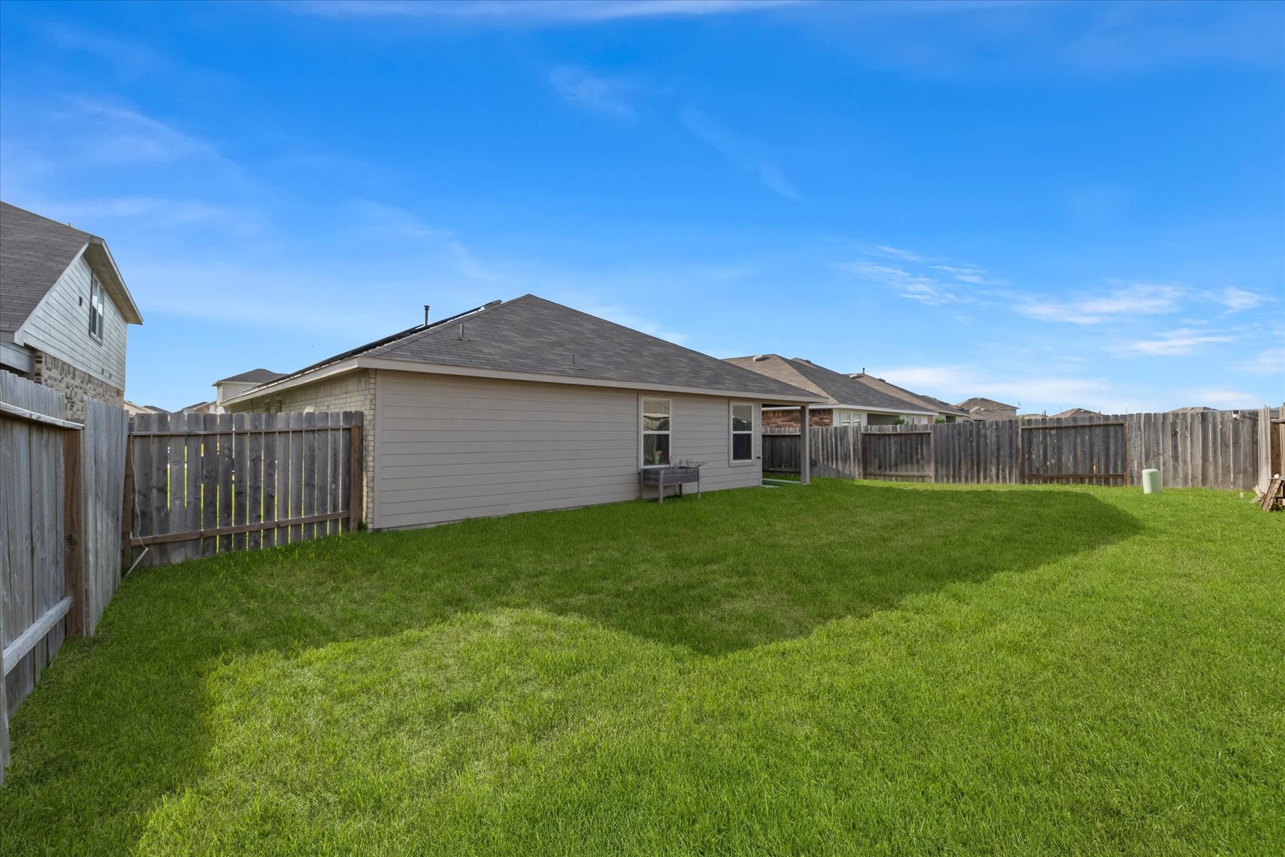 Expansive backyard ready for pets, play, or a future pool.