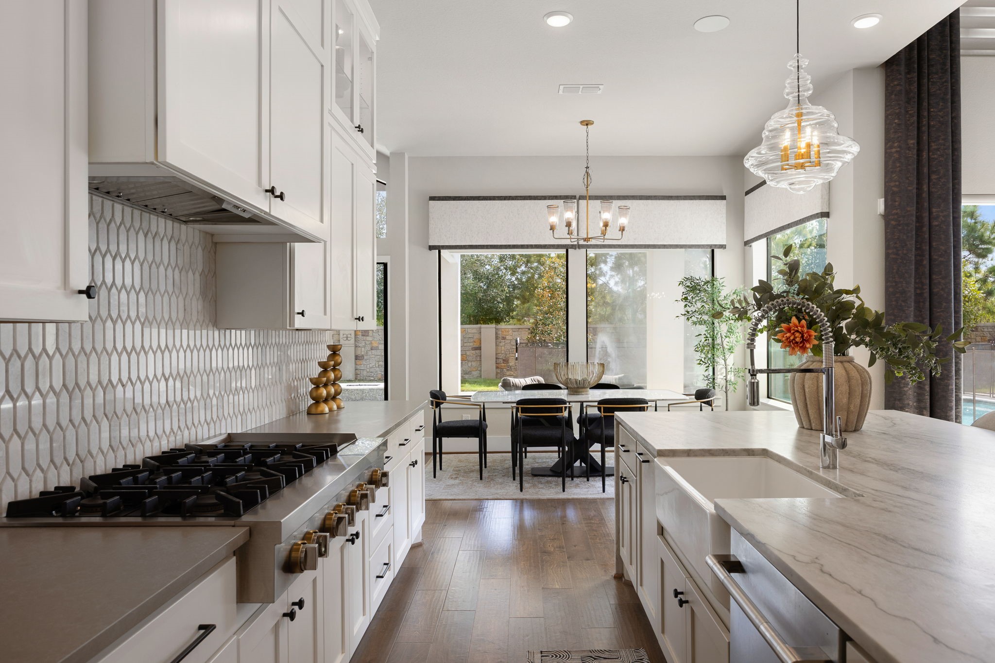 Gourmet kitchen featuring sleek countertops, stylish backsplash, and a spacious layout for everyday living.