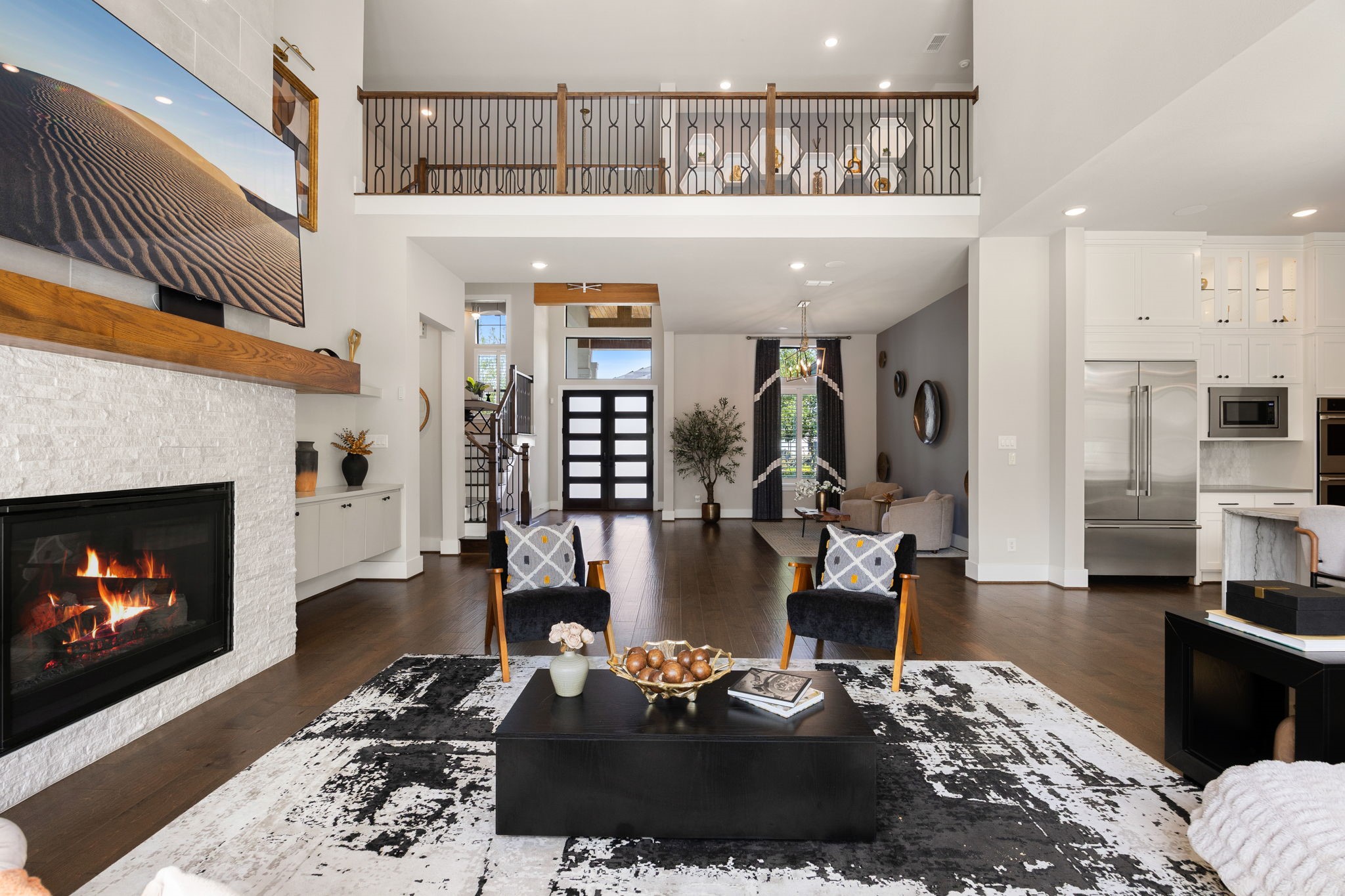 Beautifully designed living space showcasing architectural details, a statement fireplace, and an open floor plan.
