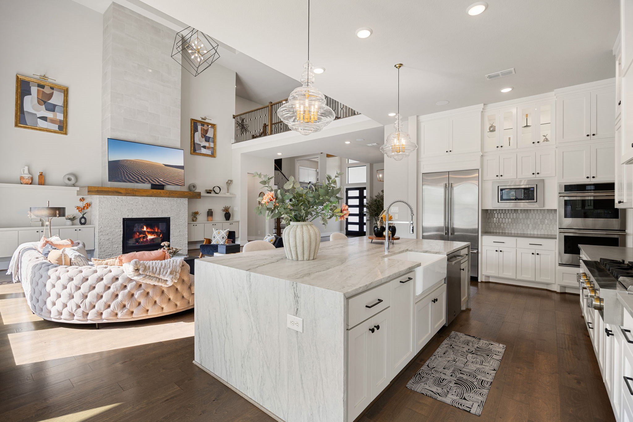 Stunning kitchen with high-end JennAir appliances including built in fridge and 6 burner gas cooktop with griddle. There is seamless flow into the living areas for entertaining.
