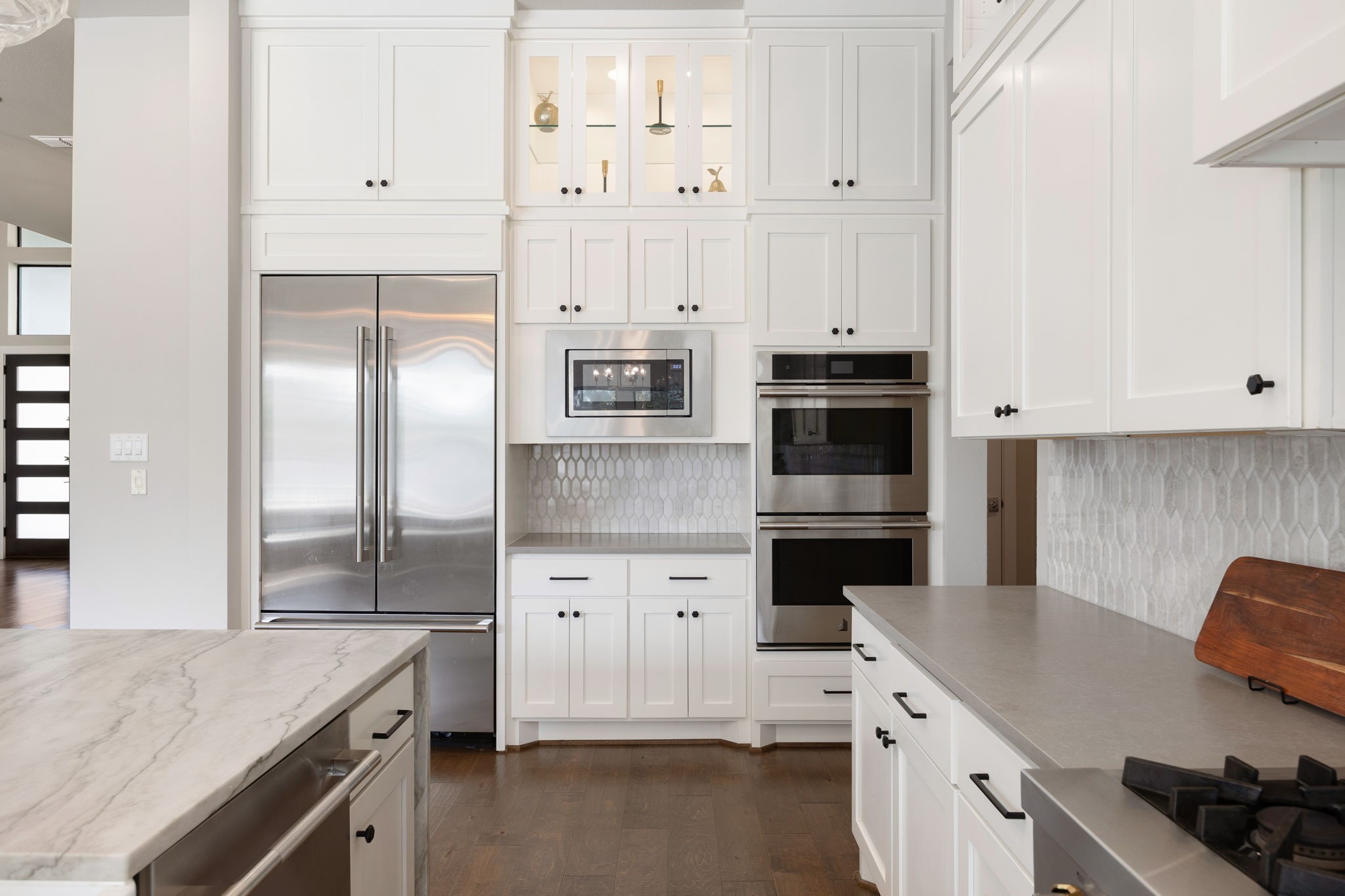 Well-designed kitchen with stainless steel appliances, extensive cabinetry, and plenty of preparation space.