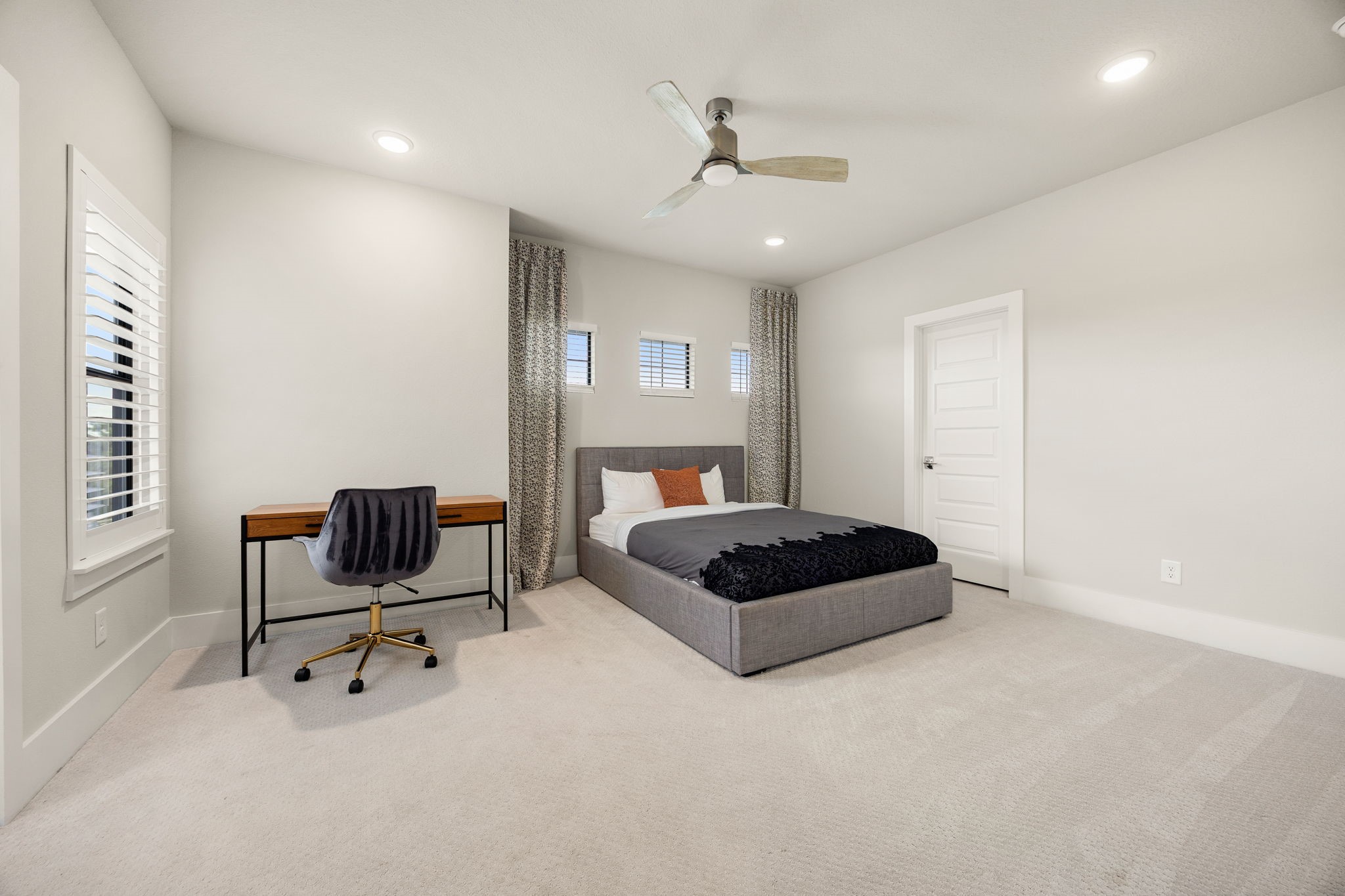 Generously sized bedroom offering flexibility for a guest suite with ensuite bathroom.