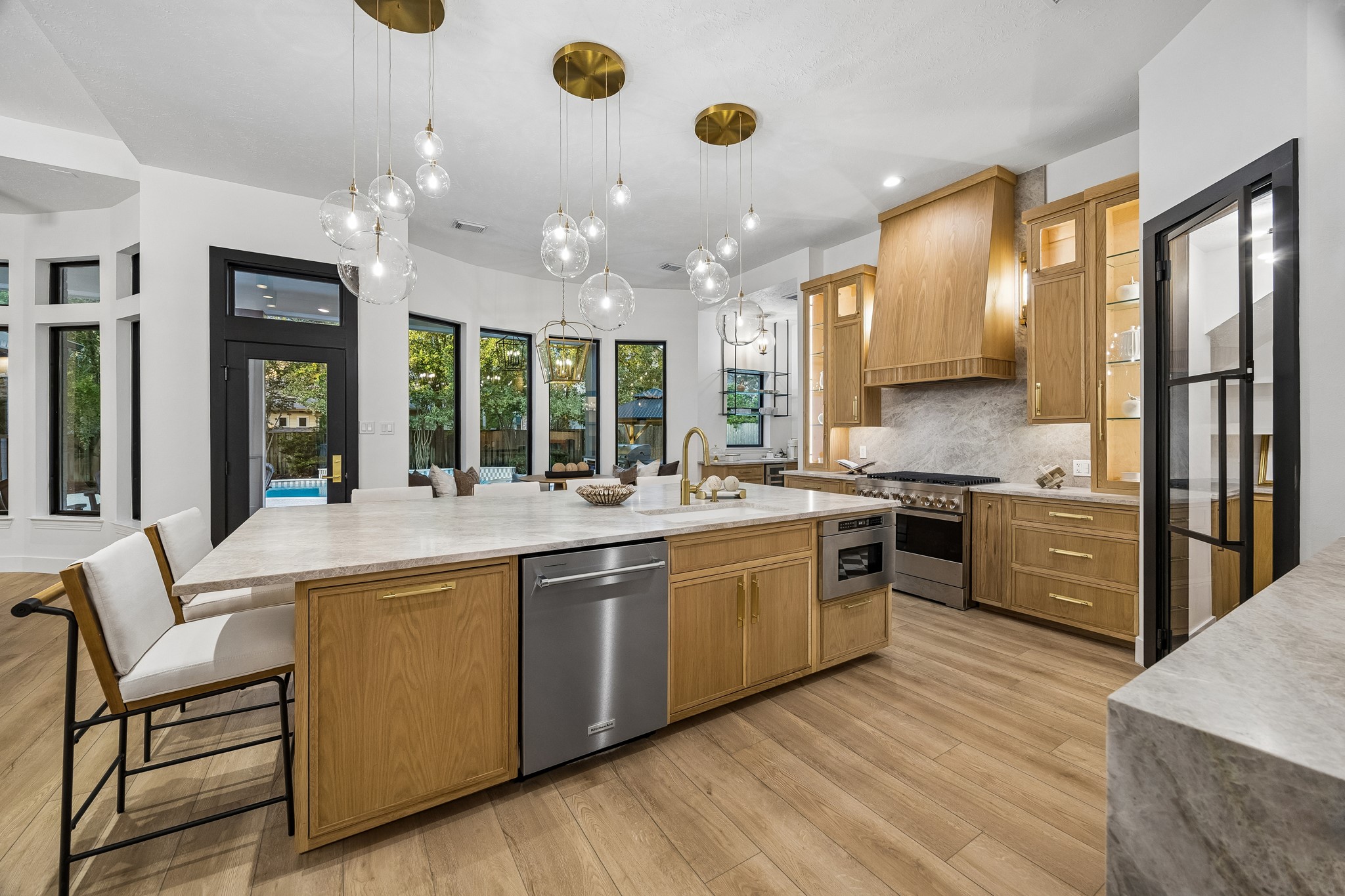 Kitchen sink, dishwasher, microwave, and a trash pull out drawer - this island is packed with functionality