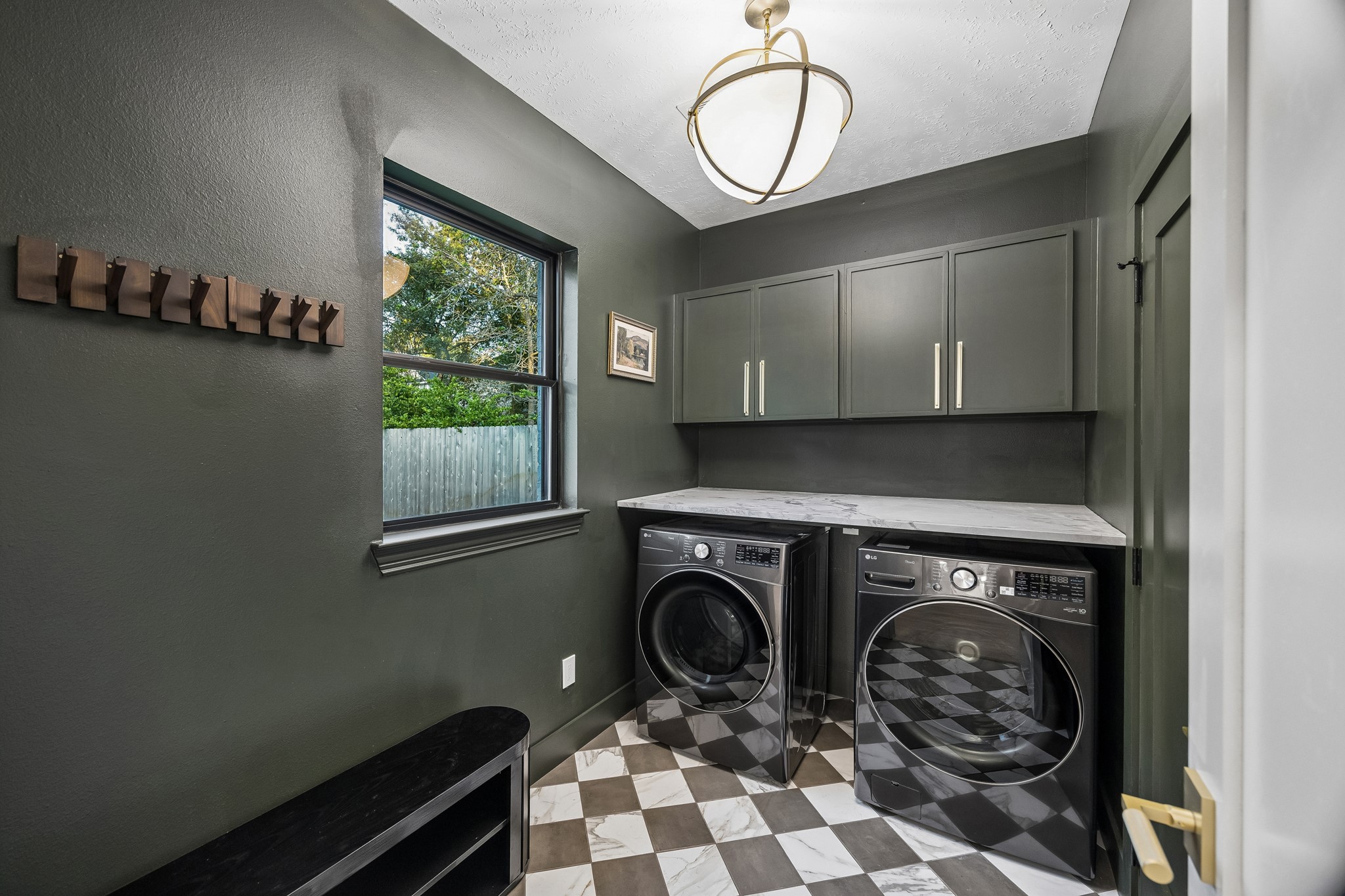 Enjoy the view outside while doing laundry in this stunning room