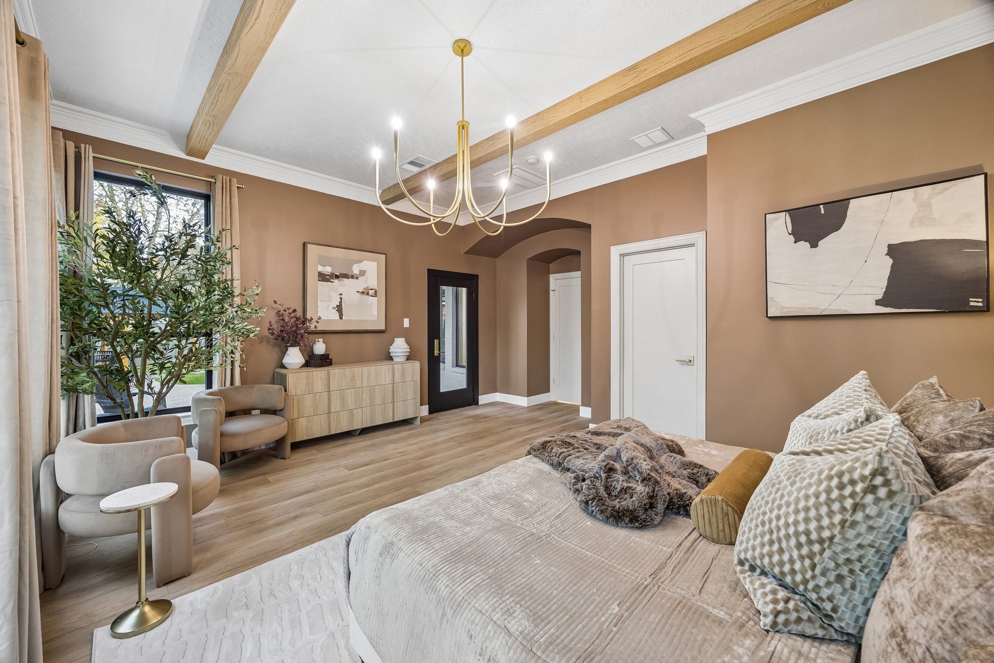 The primary bedroom offers access to the back patio