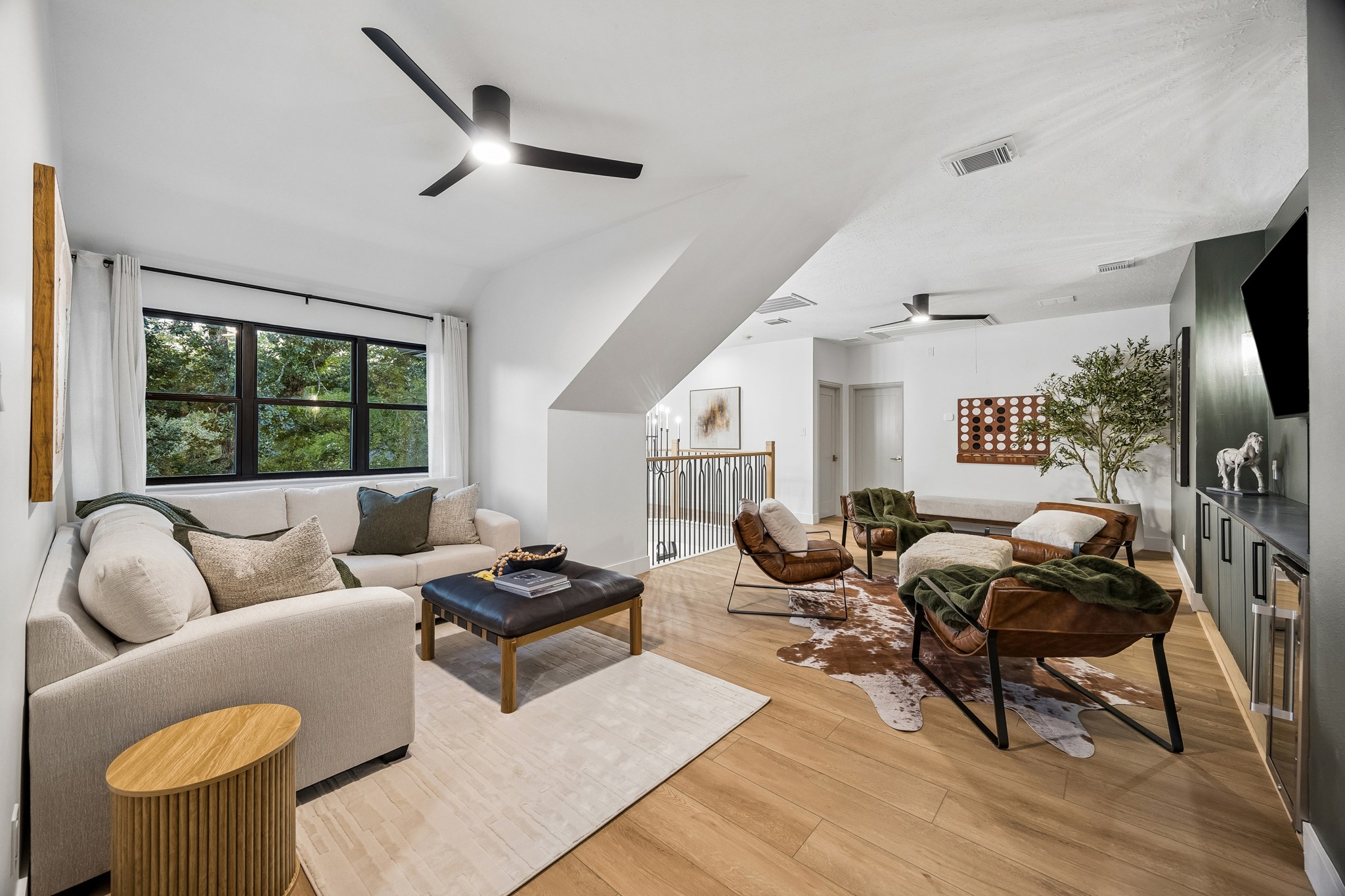 The second floor flex space has been thoughtfully renovated to include a few spaces