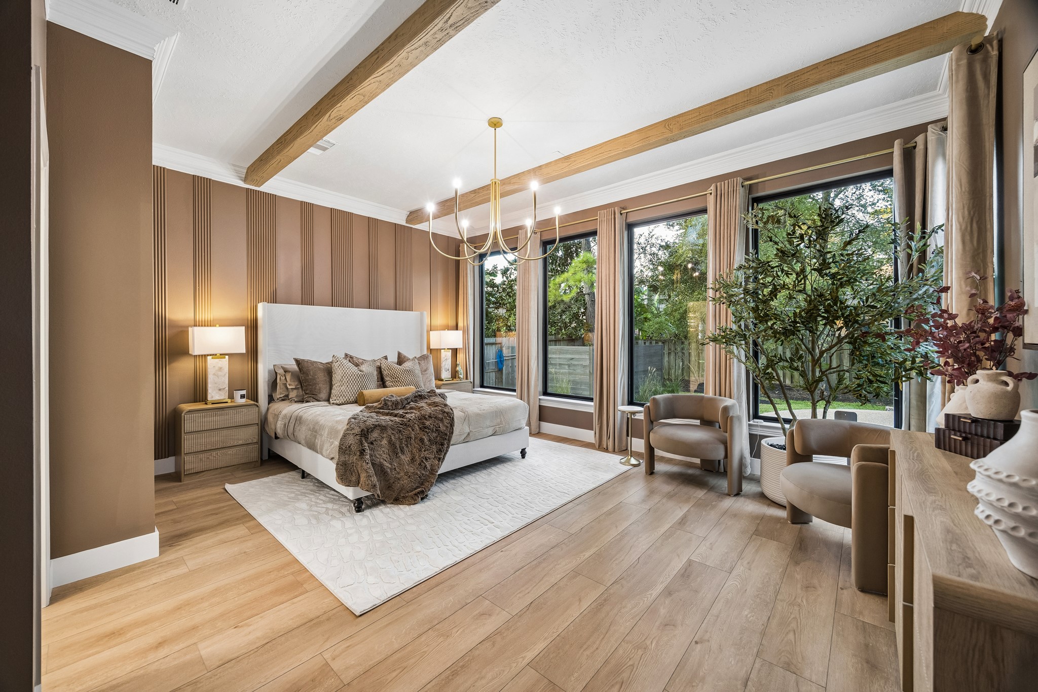 Stunning primary bedroom with access to the back patio