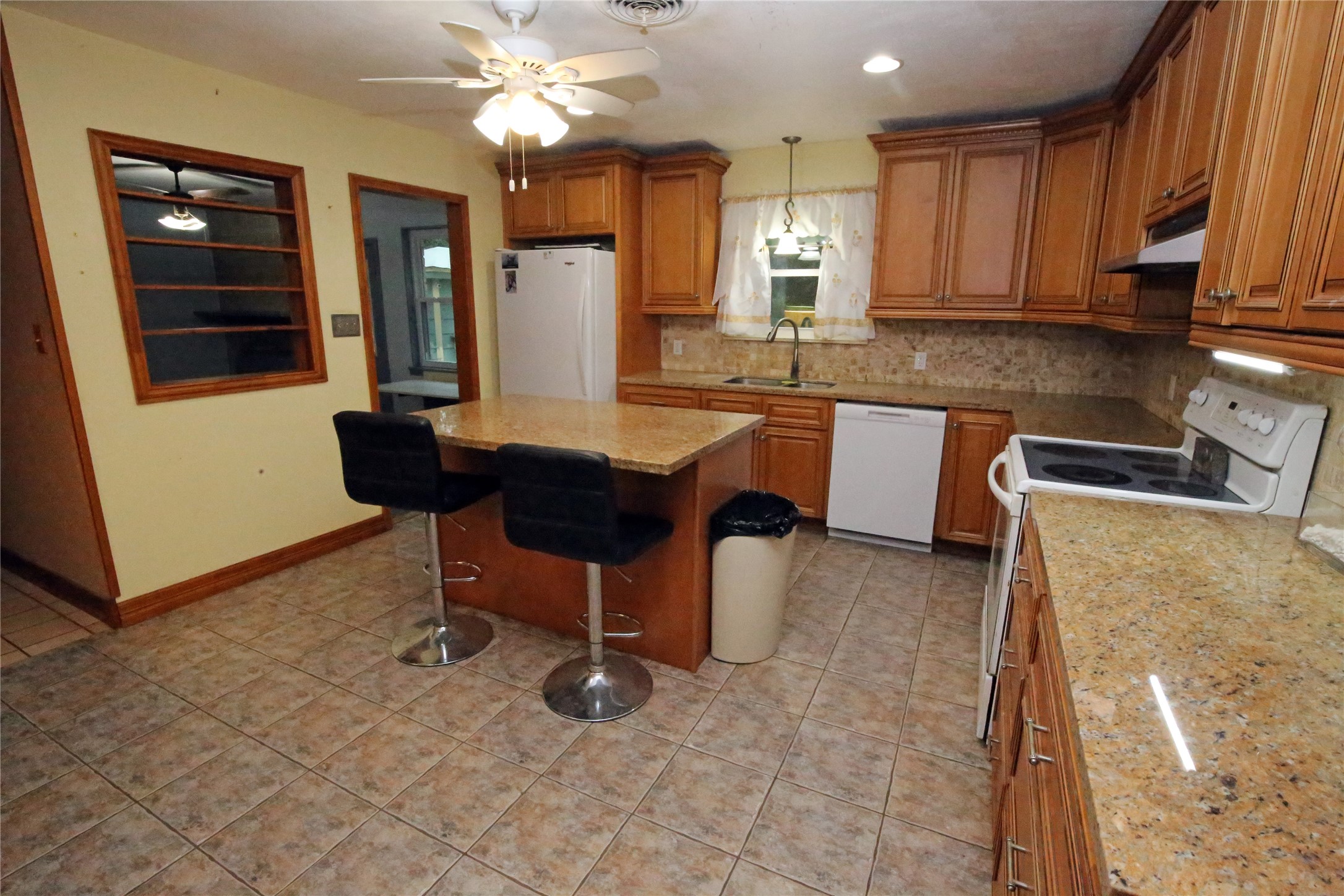 This kitchen has granite countertops and loads of cabinet space!!