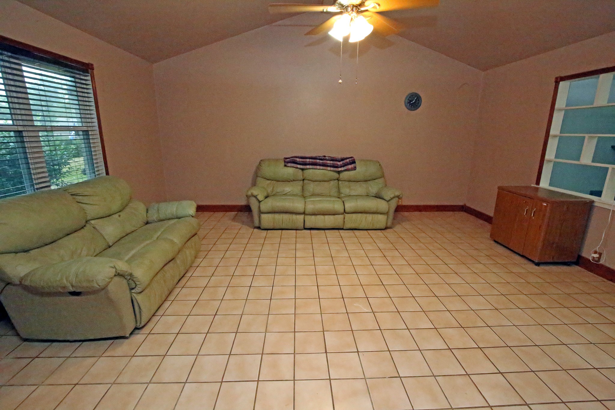 Spacious living room with tile flooring througout!