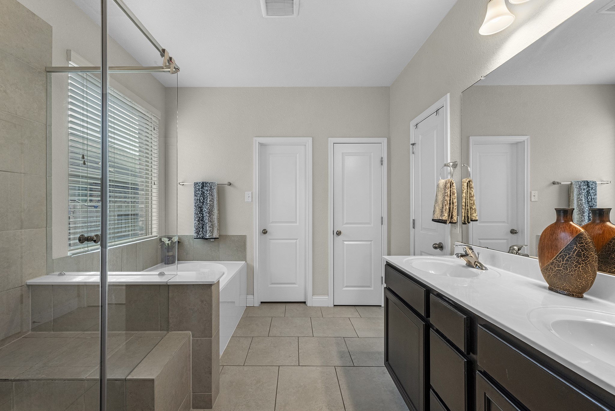 full bathroom with tub and shower