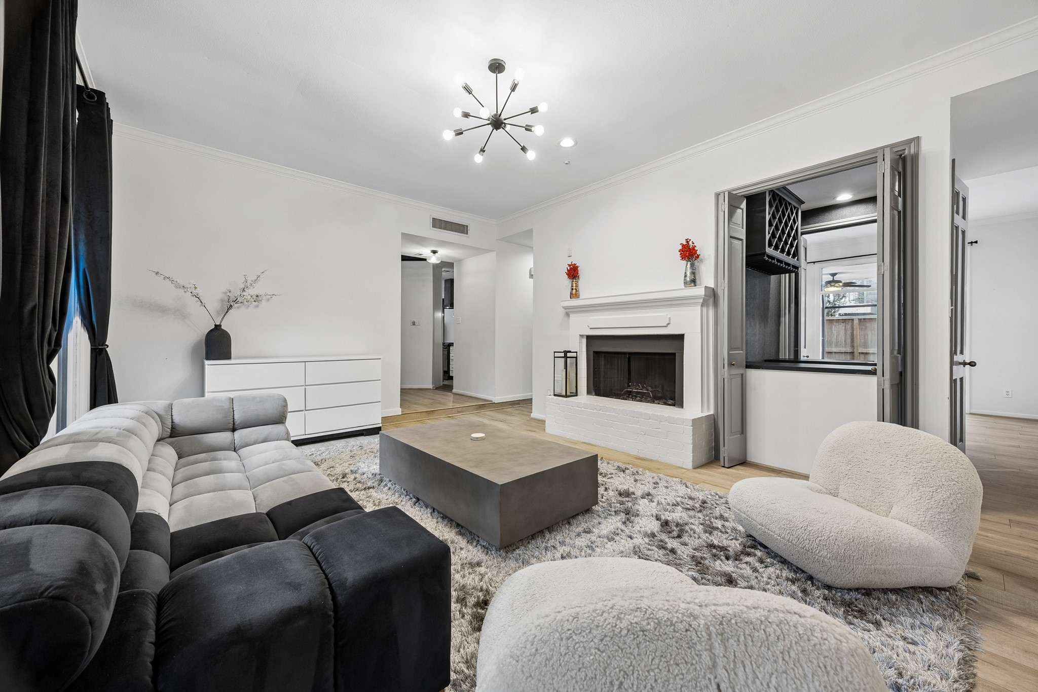 First floor living area with wood burning fireplace and bar.