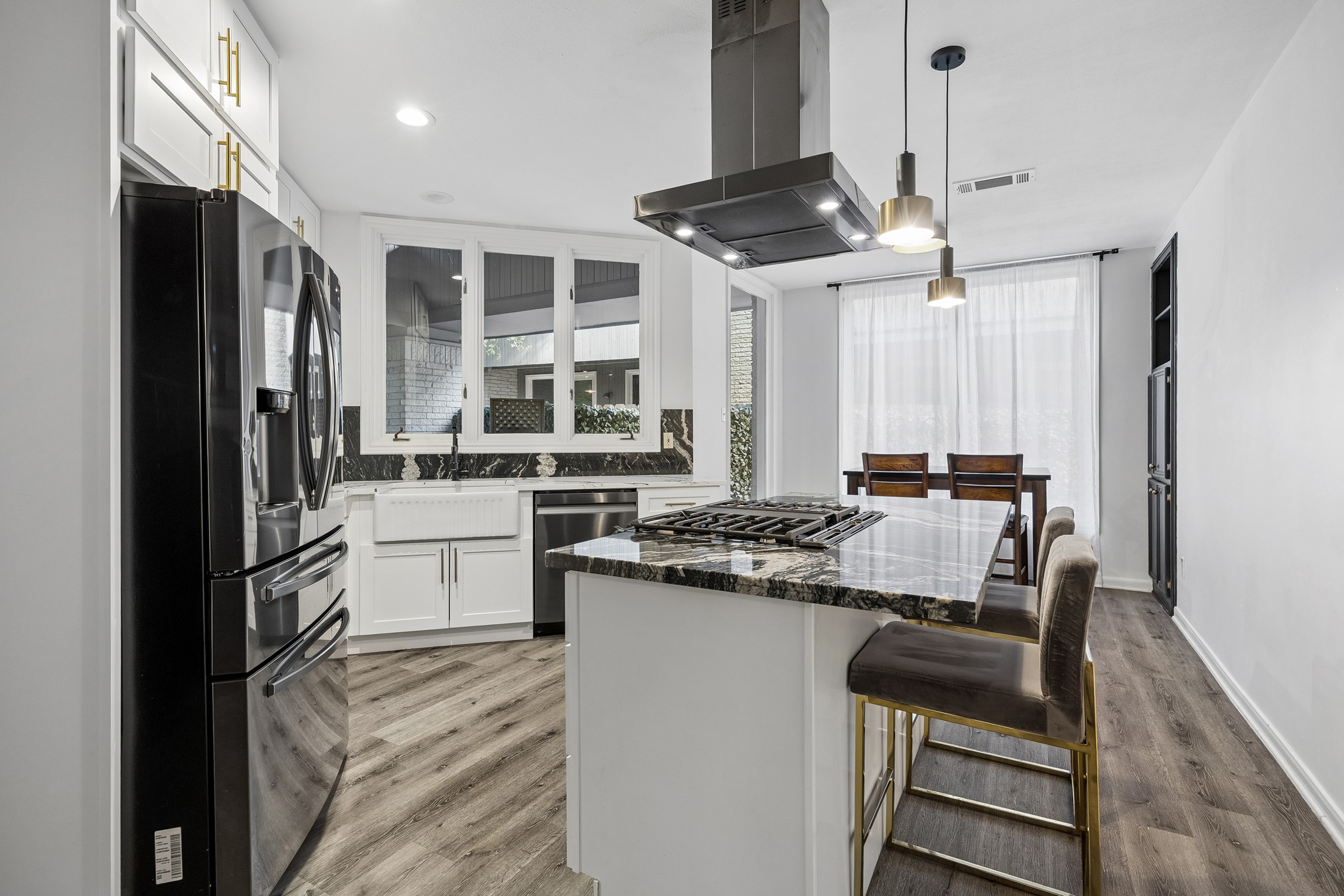 Updated Chefs kitchen with recent appliances, gas cook top and farm sink.