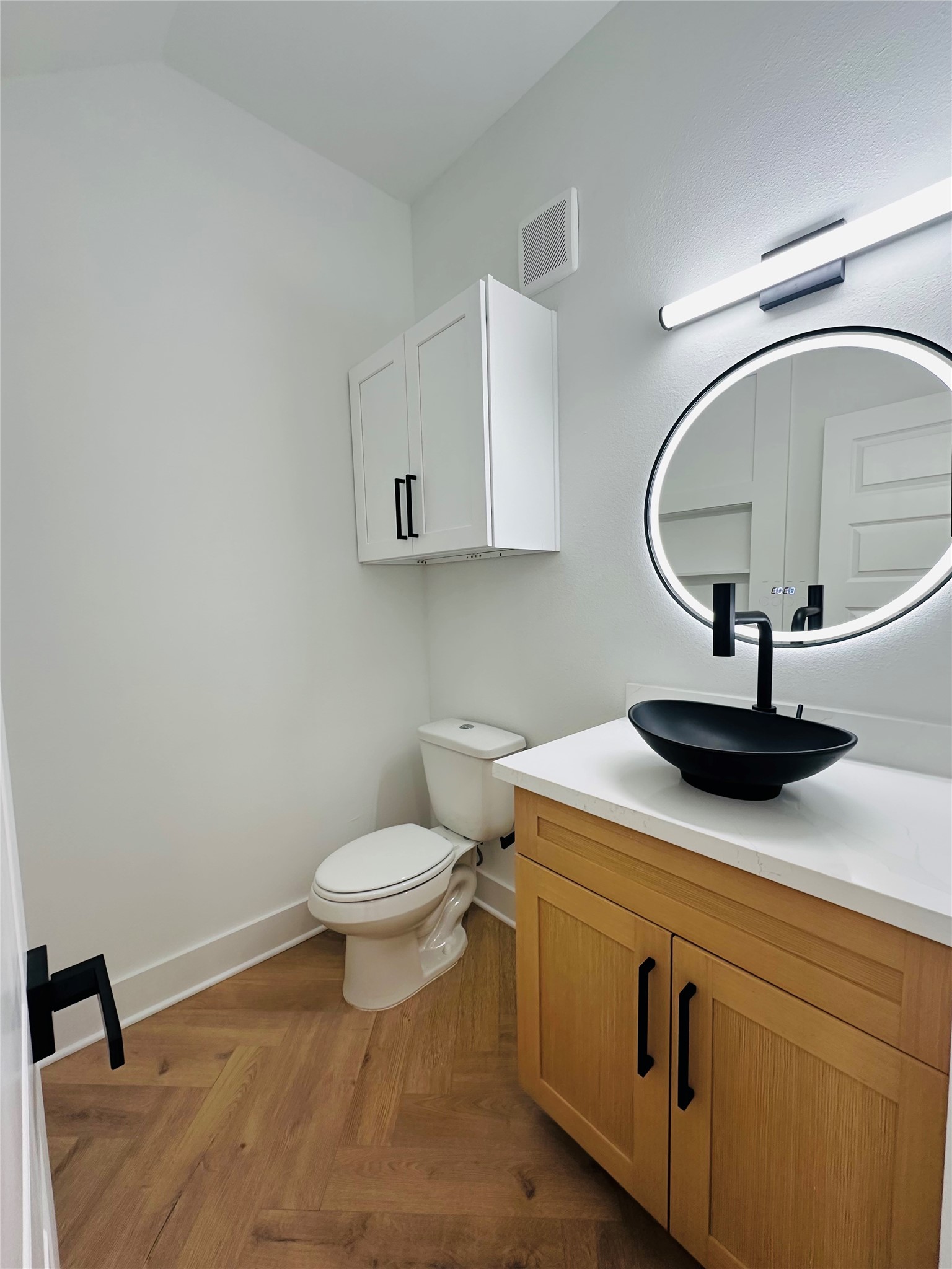 1st floor half bathroom with a hidden suprise.