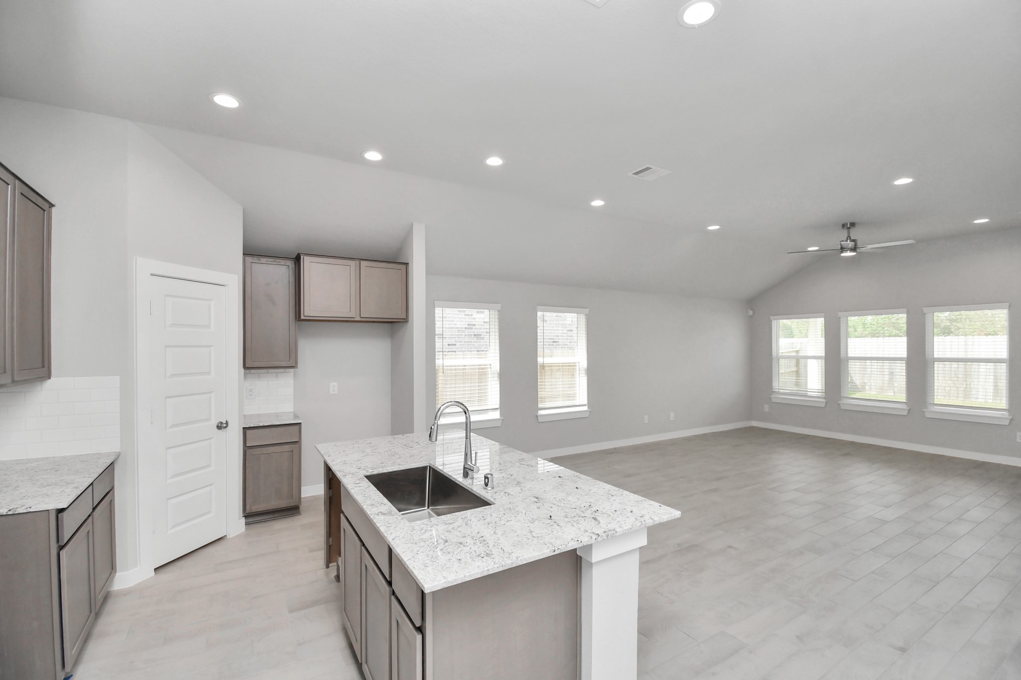 All of this overlooks your expansive family room, creating a perfect space for culinary delights and family gatherings. Sample photo of completed home with similar floor plan. Actual colors and selections may vary.