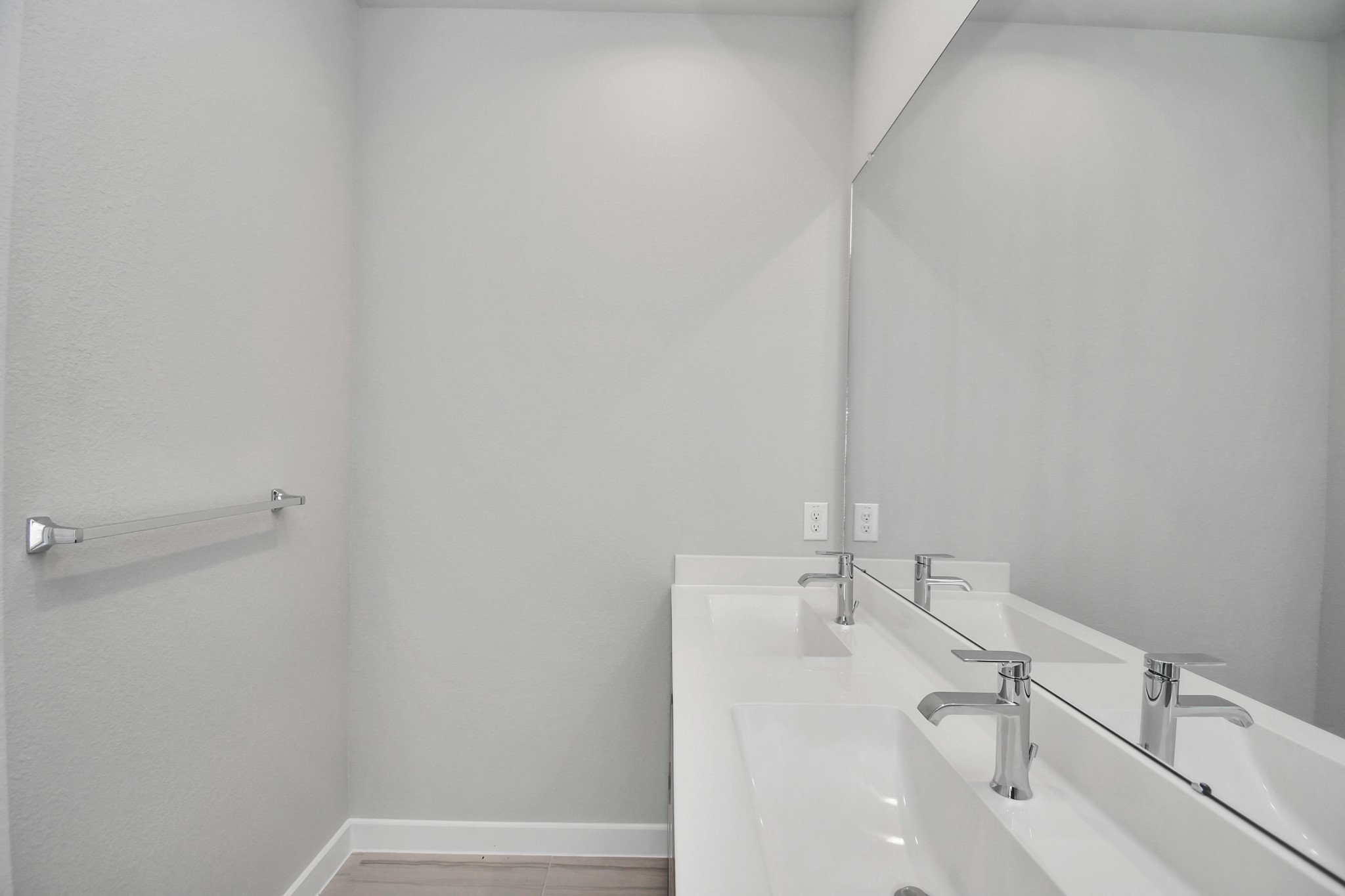 Escape to a spa-like oasis in this primary bathroom. Enjoy a walk-in shower with tile surround, a separate garden tub with custom detailing, and an elegant vanity featuring light countertops, modern hardware, and beautiful recessed lights. Experience luxury and relaxation in every detail. Sample photo of completed home with similar floor plan. Actual colors and selections may vary.