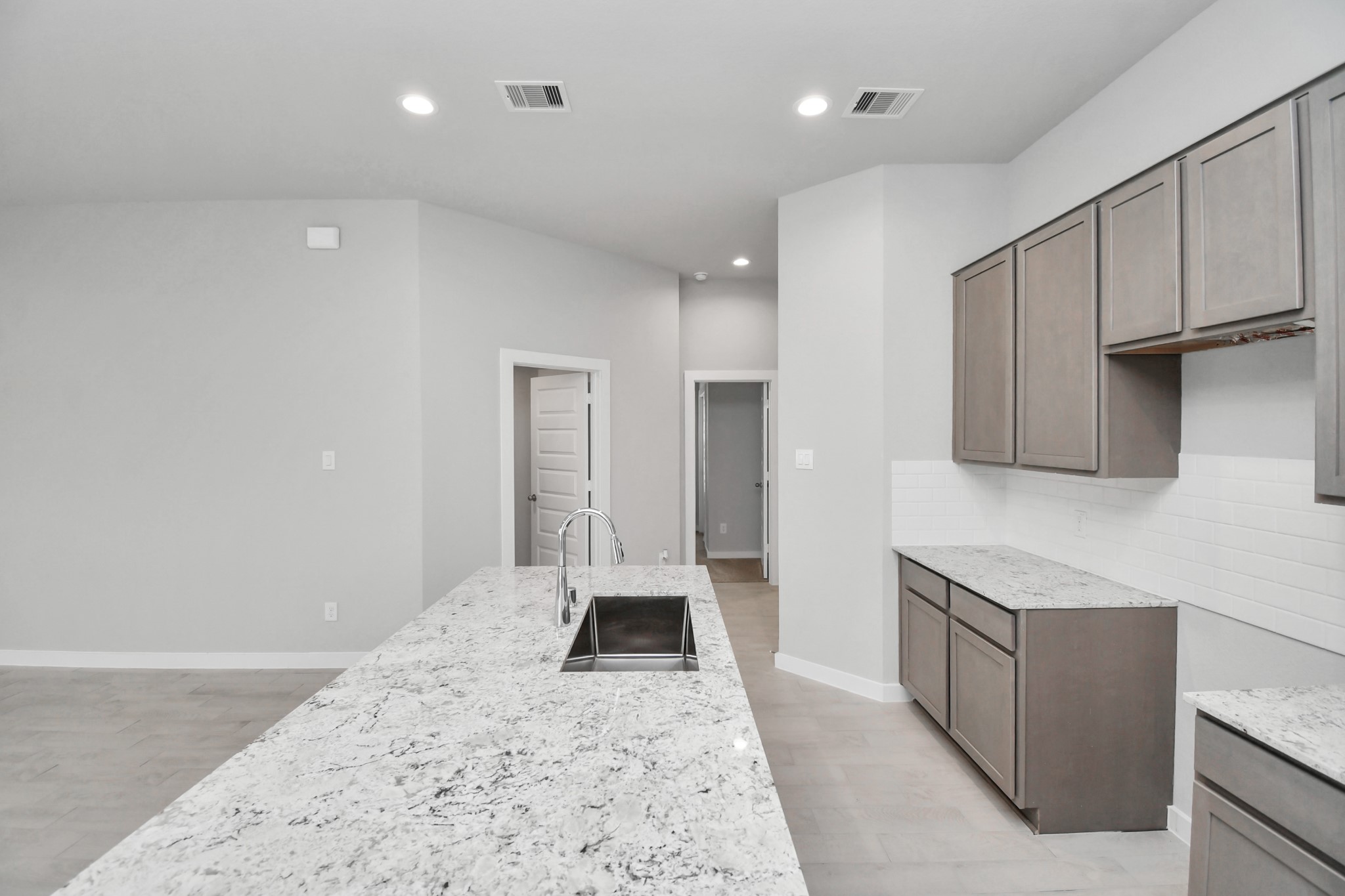 This generously spacious kitchen is a dream realized! Sample photo of completed home with similar floor plan. Actual colors and selections may vary.
