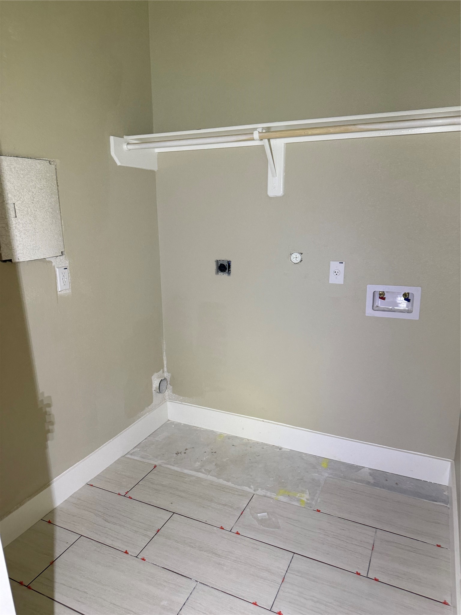 indoor utility room with tile floors