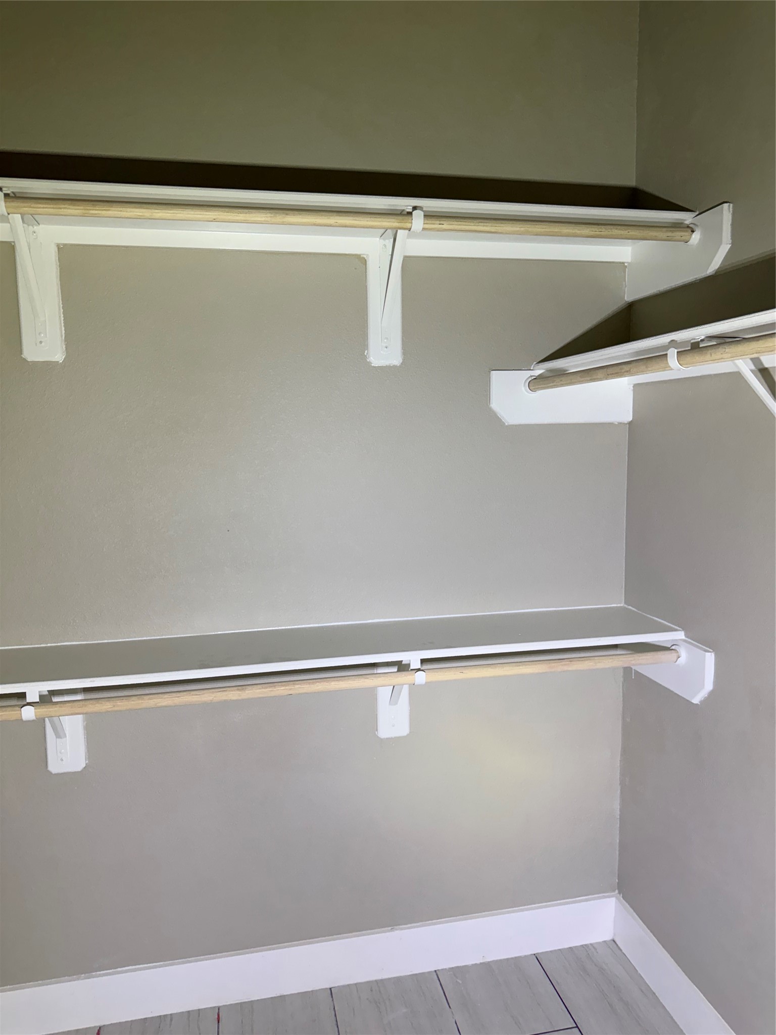 Master closet with lots of racks for clothes