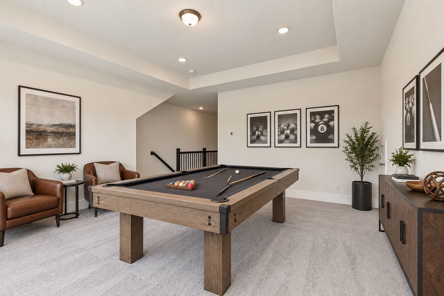 ENTERTAINMENT & FUN AWAIT! This INVITING game room offers plenty of space for recreation and relaxation, featuring a pool table, stylish lighting, and a beautifully detailed tray ceiling! Whether hosting friends or enjoying family game night, this versatile upstairs retreat is designed for memorable moments! **Photo is Virtually Staged**