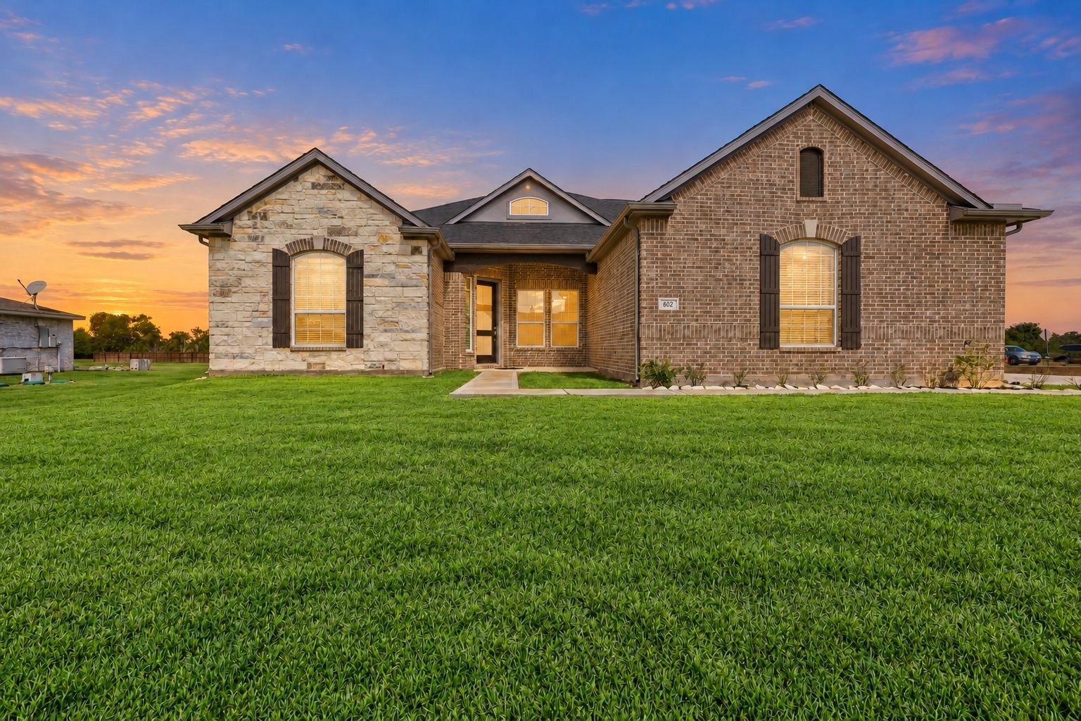 STUNNING NEW CONSTRUCTION WITH INCREDIBLE CURB APPEAL! This BEAUTIFUL CASTLEROCK COMMUNITIES HOME showcases a SPECTACULAR BRICK & STONE EXTERIOR, charming architectural details & an inviting grand entrance! Designed with ENERGY-SAVING FEATURES for modern comfort! Just LOOK at that EXPANSIVE GREEN LAWN on an IMPRESSIVE 1.163-ACRE PROPERTY! NO CROWDED LOTS OR HOMES RIGHT ON TOP OF EACH OTHER HERE! Enjoy WONDERFUL OPEN SPACE between neighboring homes, offering room to roam, garden, & more! STUNNING NEW CONSTRUCTION WITH INCREDIBLE CURB APPEAL! This BEAUTIFUL CASTLEROCK COMMUNITIES HOME showcases a SPECTACULAR BRICK & STONE EXTERIOR, charming architectural details & an inviting grand entrance! Designed with ENERGY-SAVING FEATURES for modern comfort! Just LOOK at that EXPANSIVE GREEN LAWN on an IMPRESSIVE 1.163-ACRE PROPERTY! NO CROWDED LOTS OR HOMES RIGHT ON TOP OF EACH OTHER HERE! Enjoy WONDERFUL OPEN SPACE between neighboring homes, offering room to roam, garden, & more!