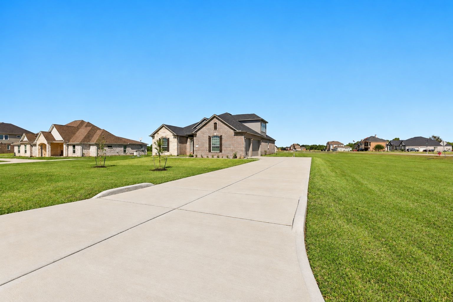 NEED PARKING SPACE? NO PROBLEM HERE! Just LOOK at this GIANT CONCRETE DRIVEWAY leading to an IMPRESSIVE 4-CAR ATTACHED GARAGE! Imagine the convenience of having PLENTY OF ROOM for your vehicles, visiting guests, hobbies & storage! This STUNNING NEW HOME sits on a MASSIVE 1.163-ACRE CORNER LOT, offering INCREDIBLE OPEN SPACE & ENDLESS POSSIBILITIES! NEED PARKING SPACE? NO PROBLEM HERE! Just LOOK at this GIANT CONCRETE DRIVEWAY leading to an IMPRESSIVE 4-CAR ATTACHED GARAGE! Imagine the convenience of having PLENTY OF ROOM for your vehicles, visiting guests, hobbies & storage! This STUNNING NEW HOME sits on a MASSIVE 1.163-ACRE CORNER LOT, offering INCREDIBLE OPEN SPACE & ENDLESS POSSIBILITIES!