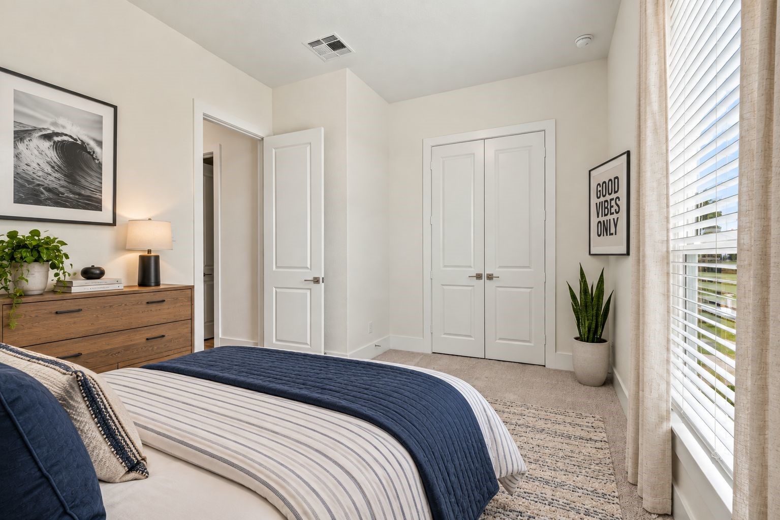 A PEACEFUL BEDROOM RETREAT! Unwind in this SERENE secondary bedroom featuring a large window, abundant natural light, a spacious closet, and a soothing neutral palette! The comfortable layout offers a welcoming retreat for family members or overnight guests. **Photo is Virtually Staged**