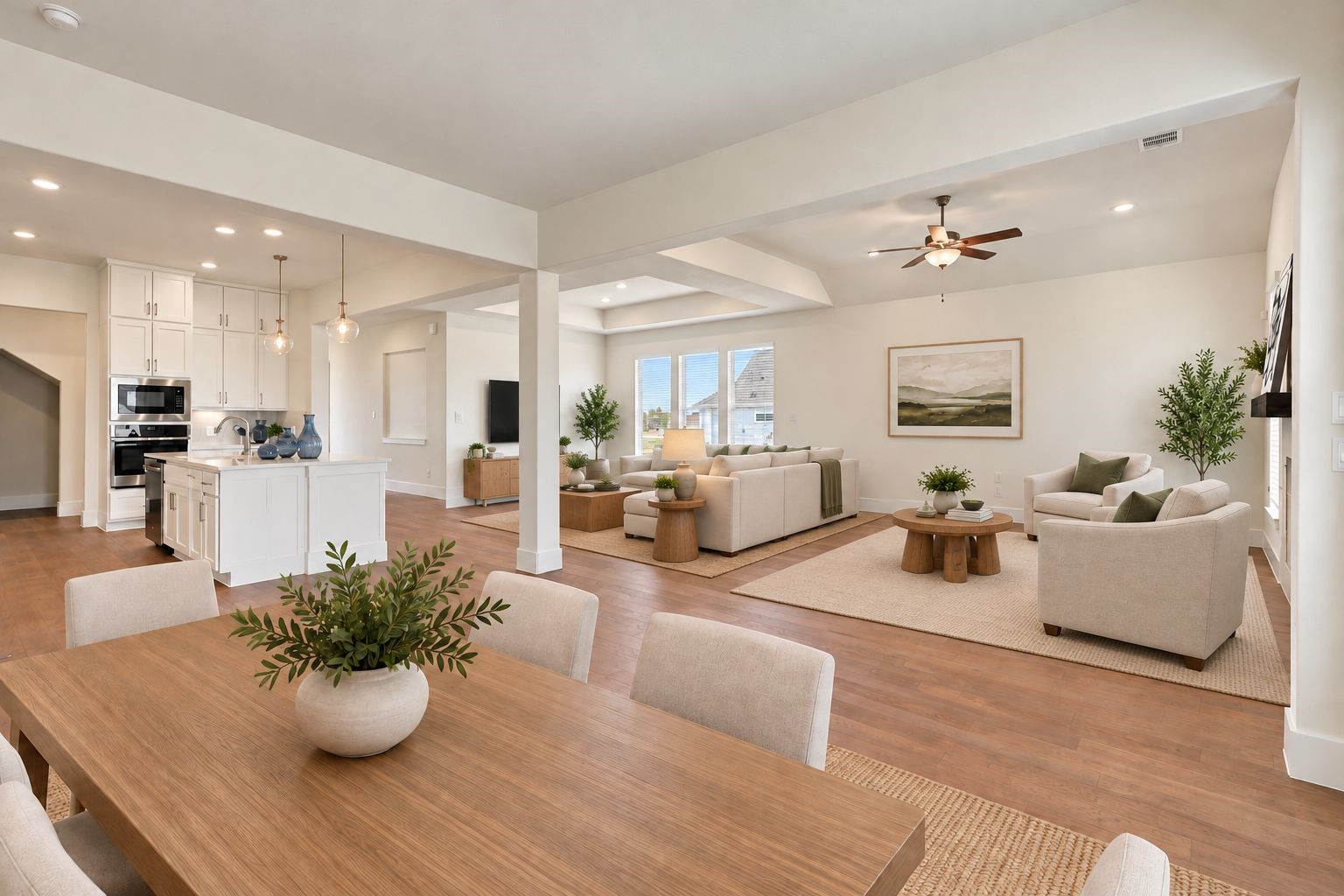 ELEGANT OPEN-CONCEPT LIVING! Experience the perfect blend of style and functionality in this spacious open-concept design, showcasing the dining area, inviting family room, and BEAUTIFUL KITCHEN! GORGEOUS ENGINEERED WOOD FLOORING flows throughout the main living areas, creating a warm, cohesive look ideal for entertaining and everyday living! **Photo is Virtually Staged**