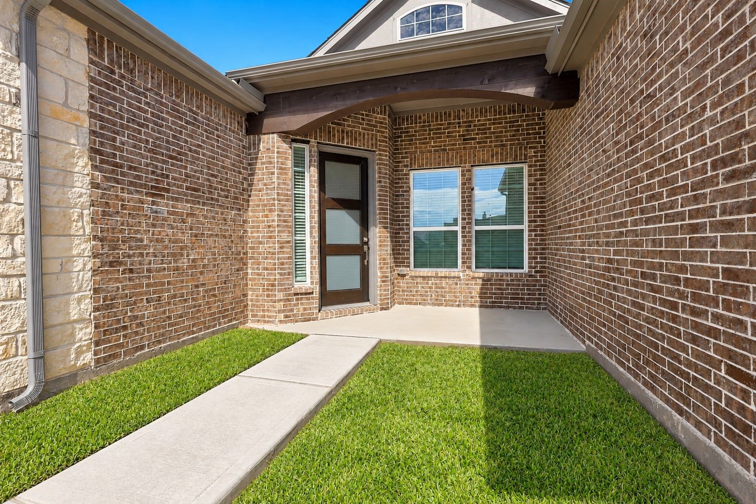 CHARMING & PRIVATE ENTRY COURTYARD! Make a wonderful first impression with this inviting entry featuring beautiful brick and stone accents, a stylish front door, and a charming courtyard-style setting! A welcoming architectural detail that adds character and appeal to this beautiful new-construction home! CHARMING & PRIVATE ENTRY COURTYARD! Make a wonderful first impression with this inviting entry featuring beautiful brick and stone accents, a stylish front door, and a charming courtyard-style setting! A welcoming architectural detail that adds character and appeal to this beautiful new-construction home!
