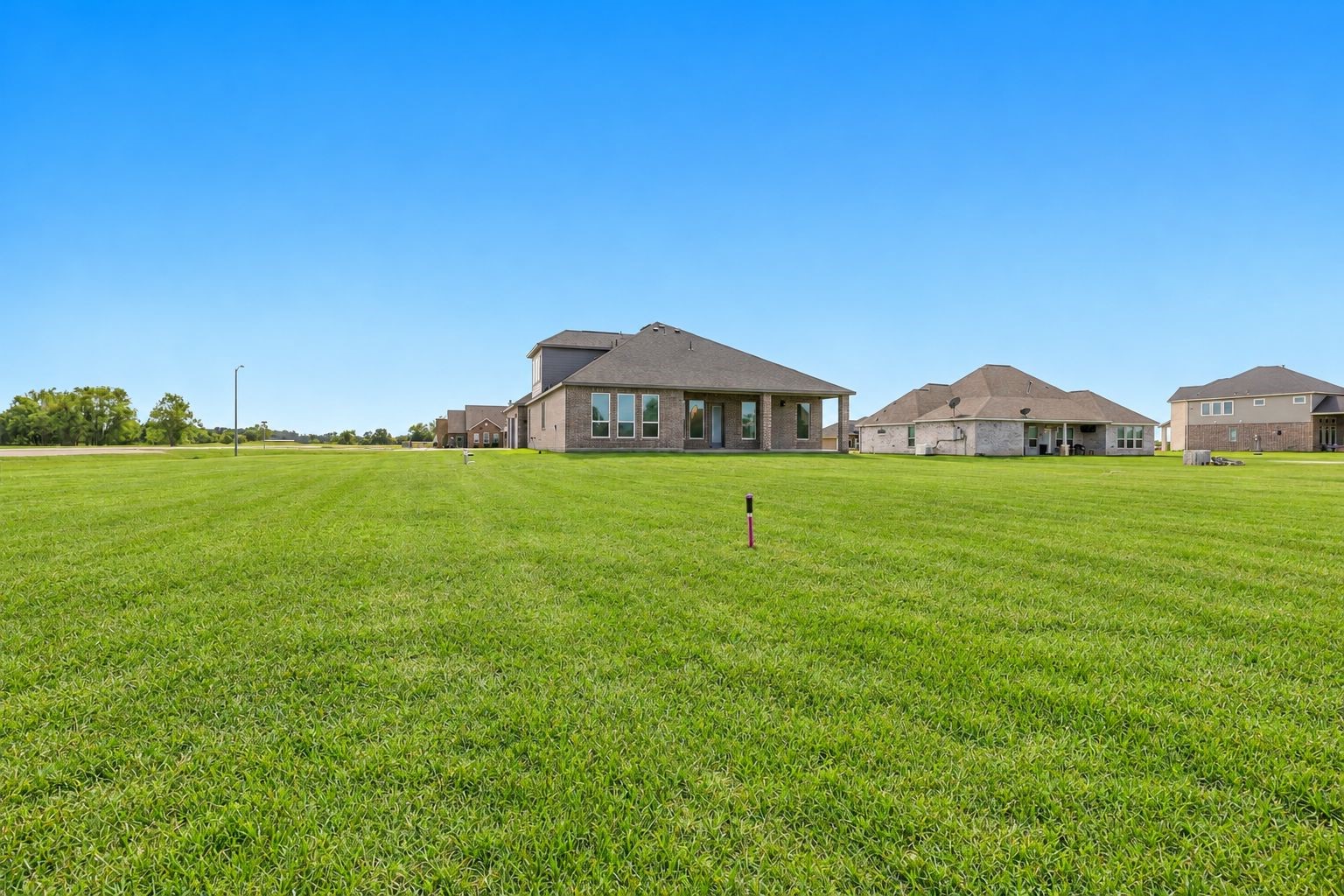 EXPANSIVE LOT & OPEN VIEWS! Enjoy the impressive outdoor setting of this beautiful new-construction home, surrounded by a wide-open lawn and peaceful neighborhood views! The approximately 1.163-ACRE LOT offers exceptional space for outdoor activities, gardening, entertaining, and creating your own dream backyard!