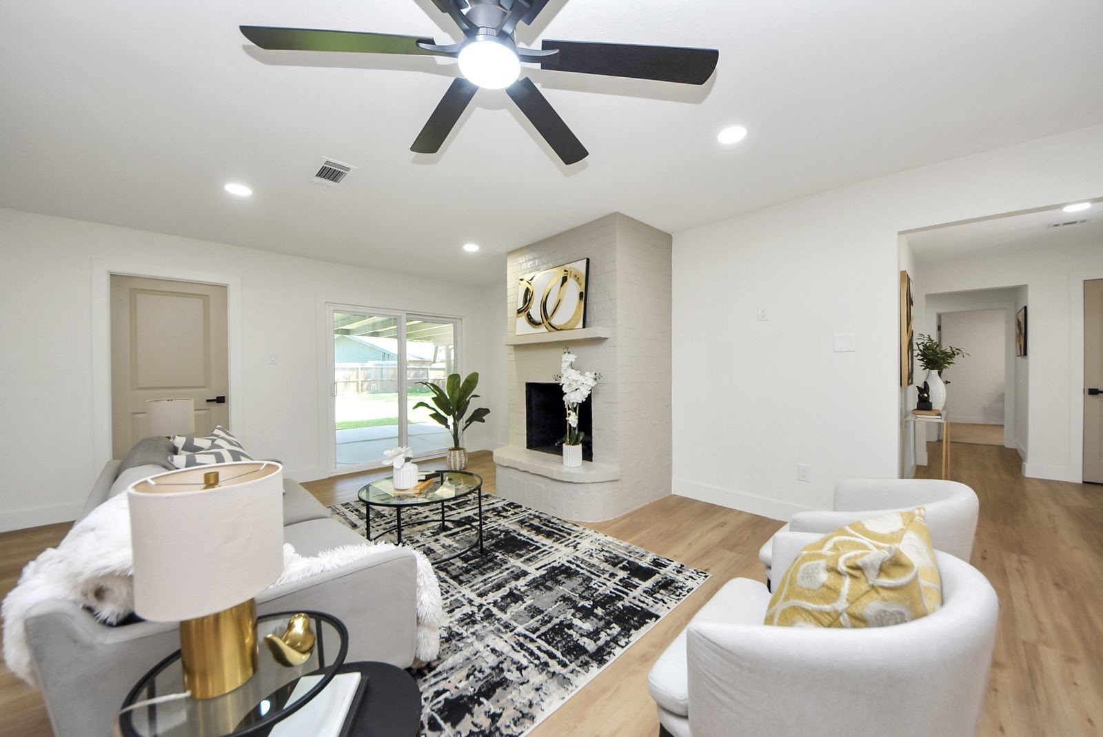 The door to the left of the sliding doors, leads to the laundry room, garage and half bath. The foyer to the right leads to the bedrooms.