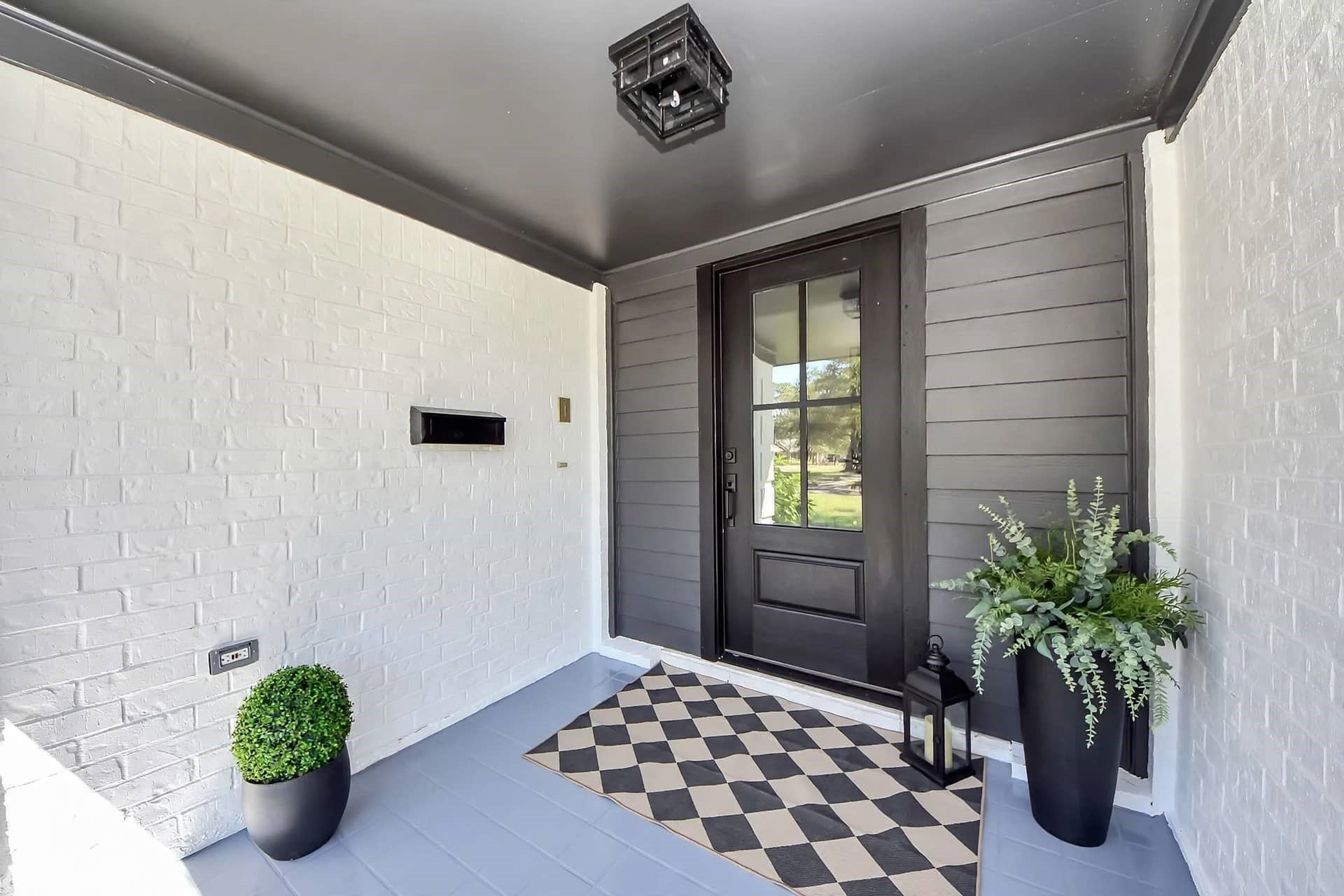 New modern black & glass door with black soffit paint accent really brings this together.