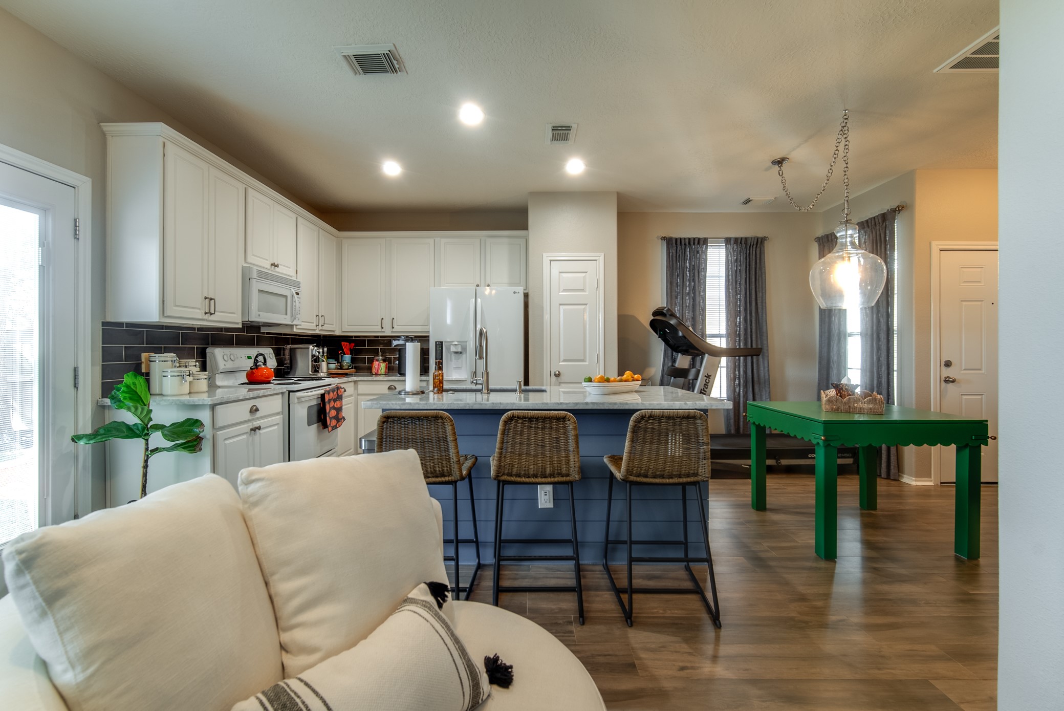 Living room open to the kitchen and dining area