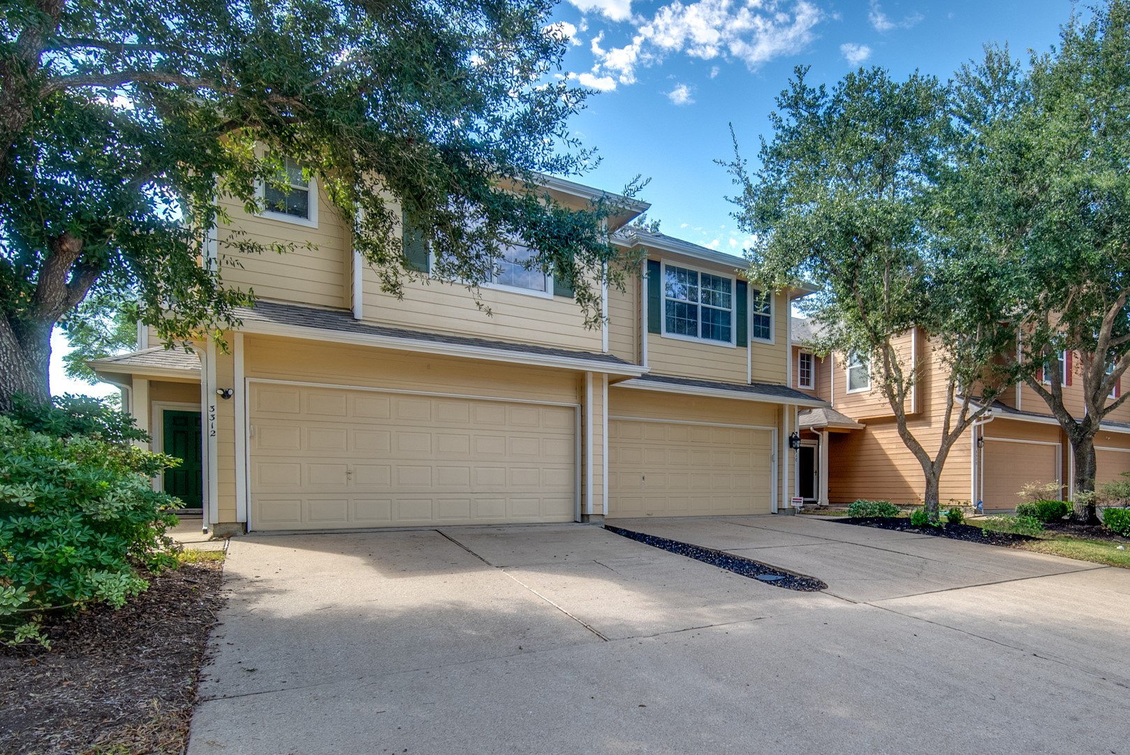 Townhome with garage and wide driveway