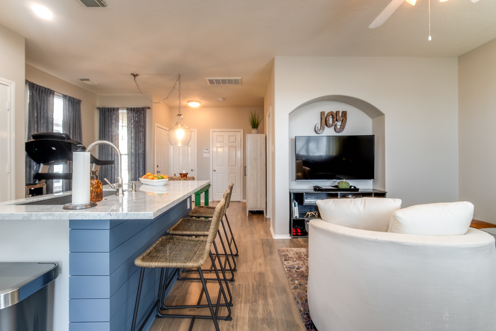 Walls of windows on the first floor and showcase the updated island with accent
