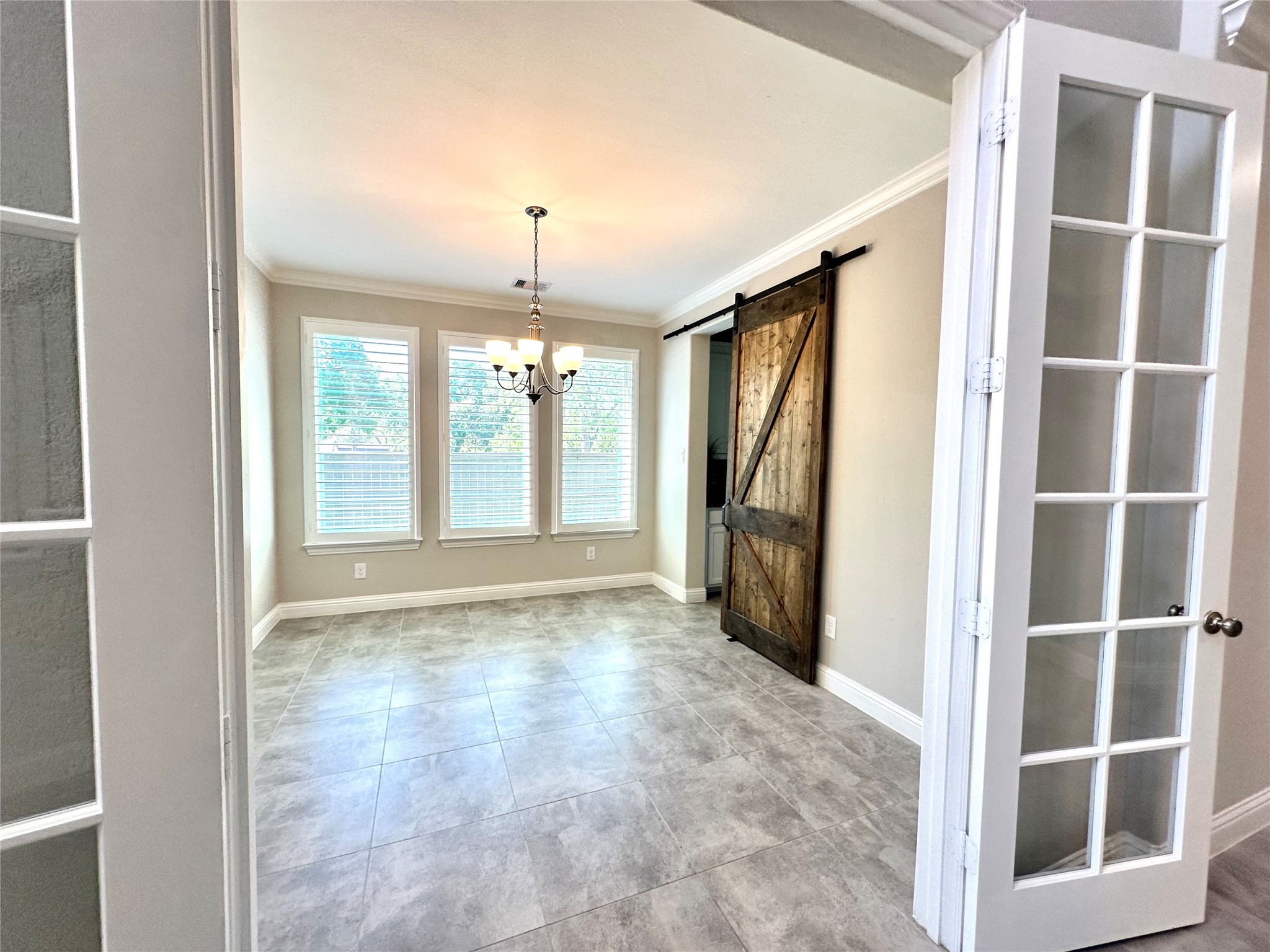 Elegant dining area with double glass doors Elegant dining area with double glass doors