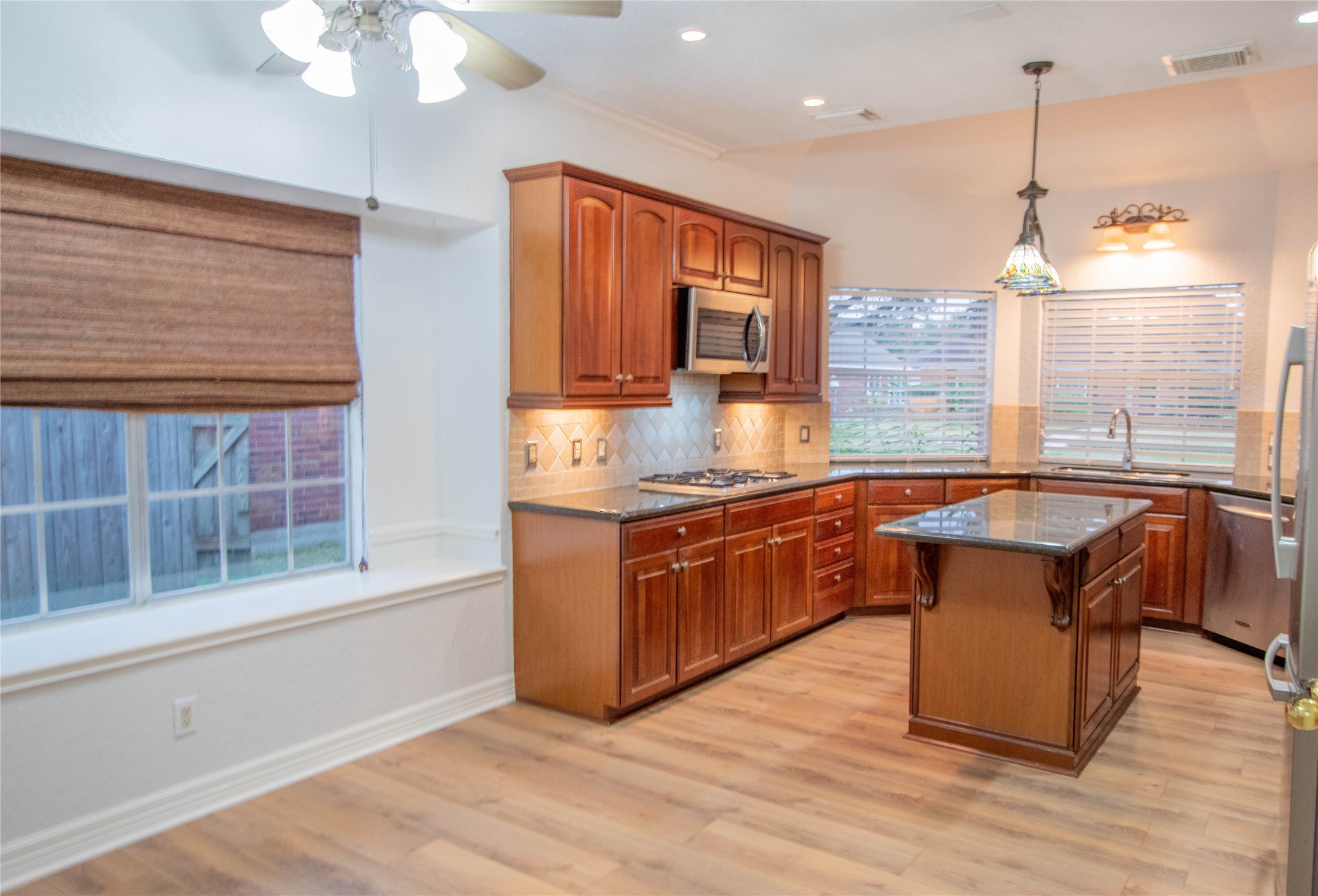 The open area from the breakfast to the kitchen, the side window is deep enough for a cushion/seating arrangement.
