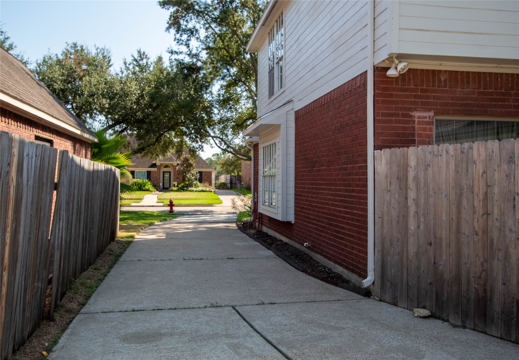 This is a long driveway with plenty of room for large or many vehicles.