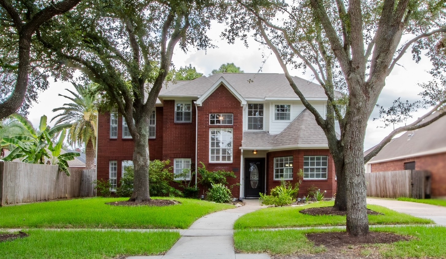 Welcome home to a beautiful, low-maintenance landscape with a front yard sprinkler system.