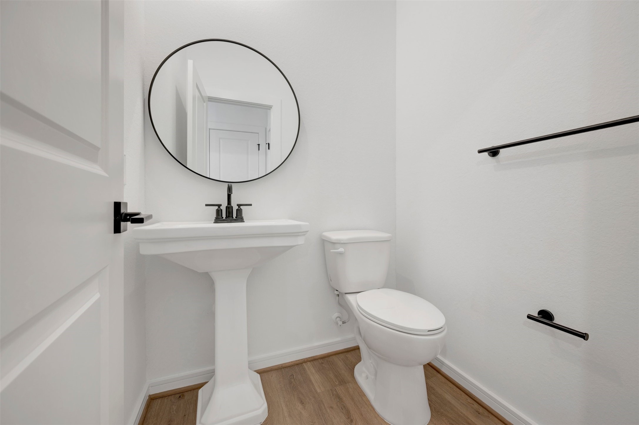 Half bath (*Photo not of actual home and used for illustration purposes only. Colors/finishes may differ from the ones currently selected in the home.)