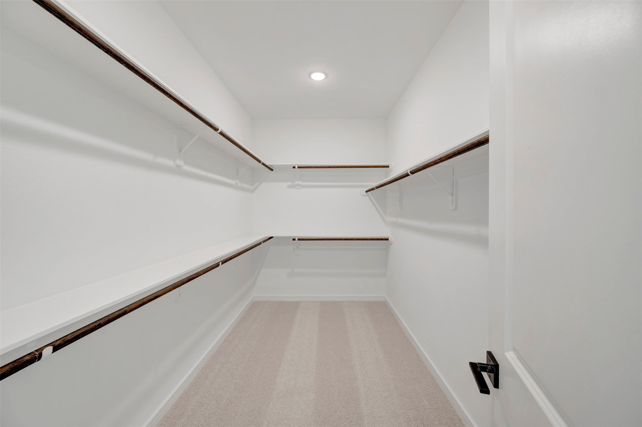 Primary walk-in closet (*Photo not of actual home and used for illustration purposes only. Colors/finishes may differ from the ones currently selected in the home.)