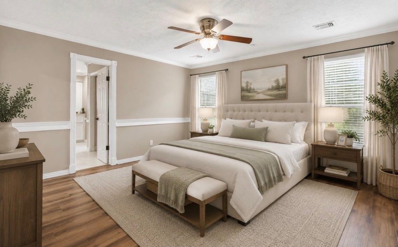 The primary bedroom is virtually staged to give the potential buyer an idea of how to furnish this space.