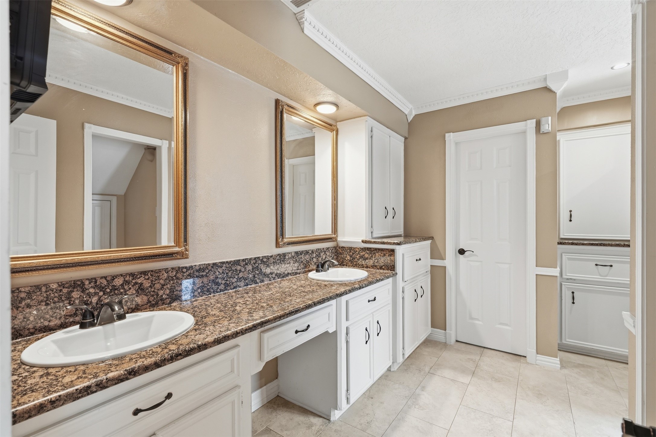 The primary bathroom features 2 sinks, elegant finishes, and a thoughtfully designed layout.