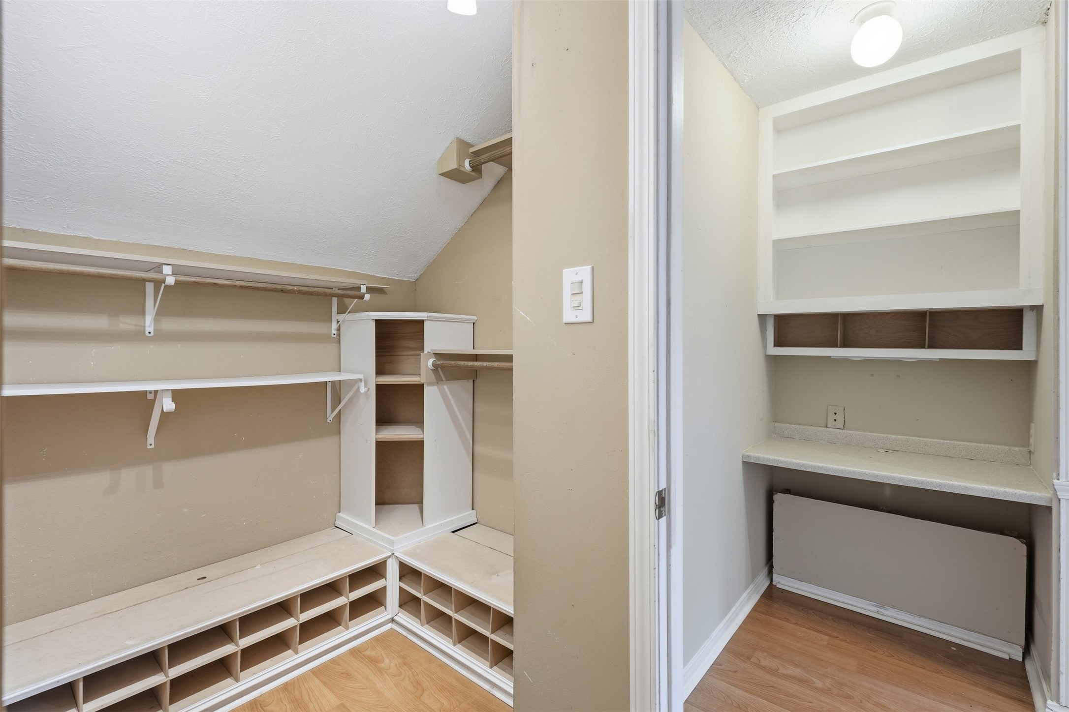 Walk-in closet offers additional storage and organization to complement the spacious bedroom.