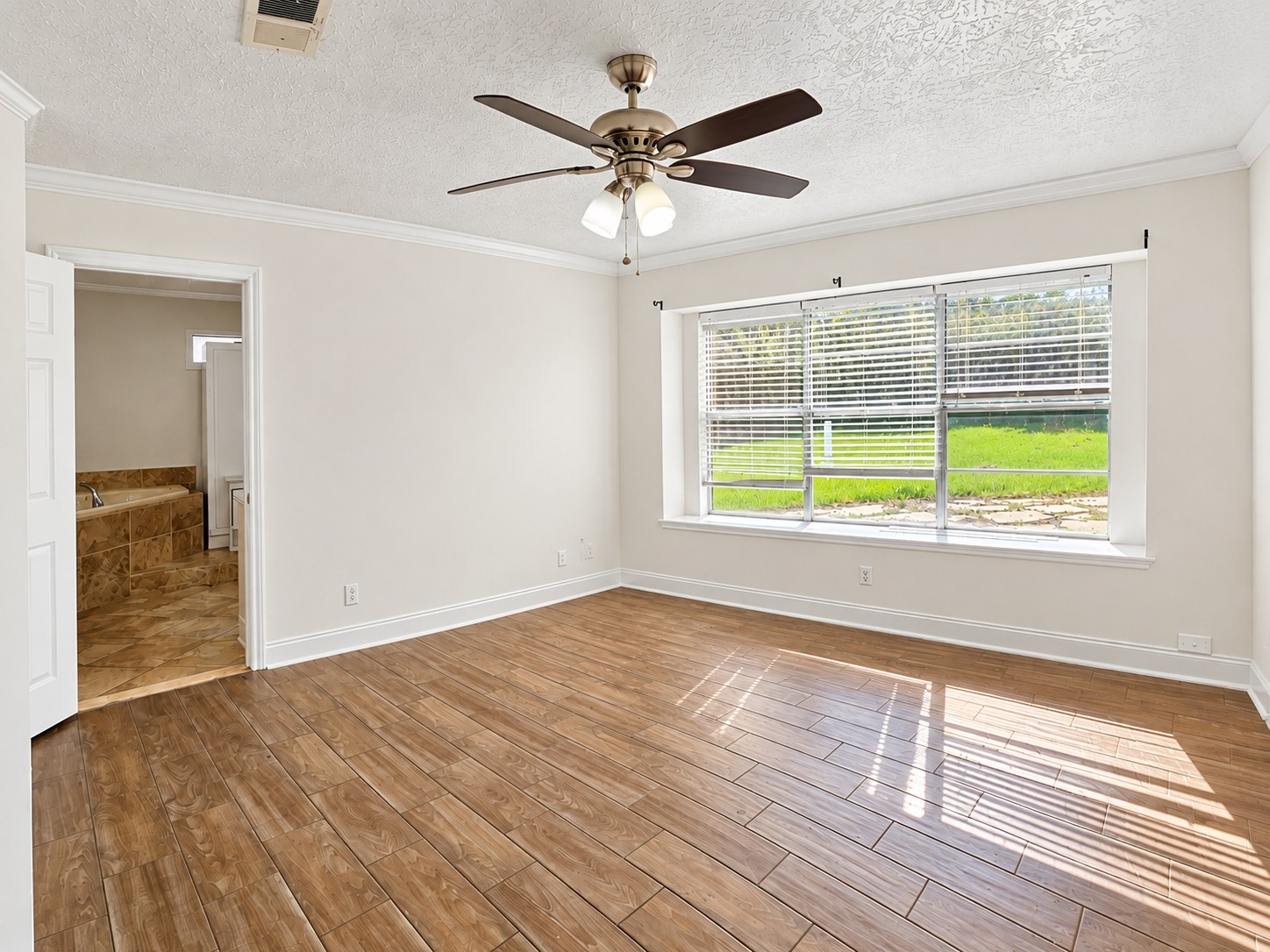 Large primary bedroom with plenty of natural light and large en suite!