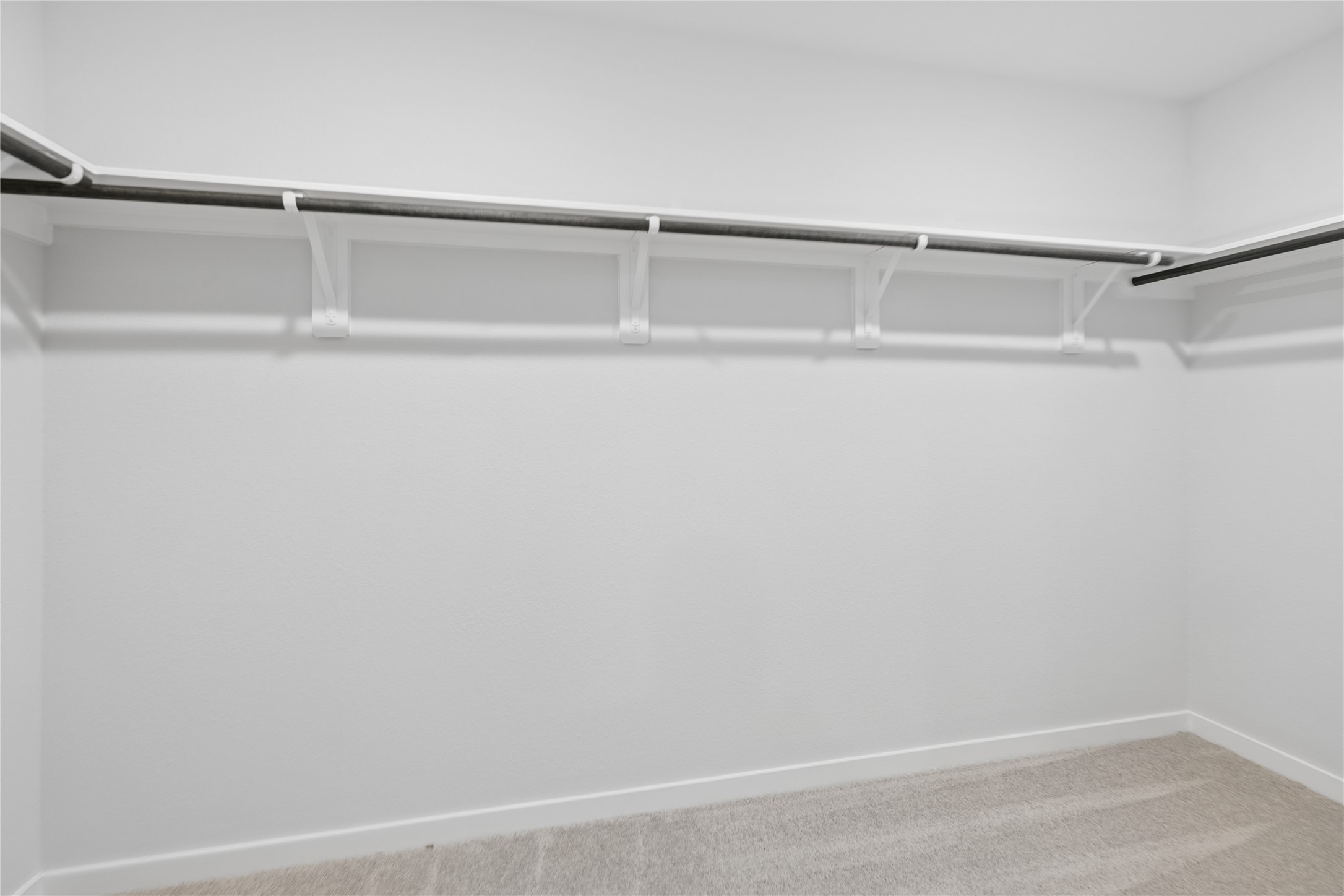 Expansive and well-organized, the primary closet offers ample space for all your wardrobe needs with sleek shelving and hanging options.