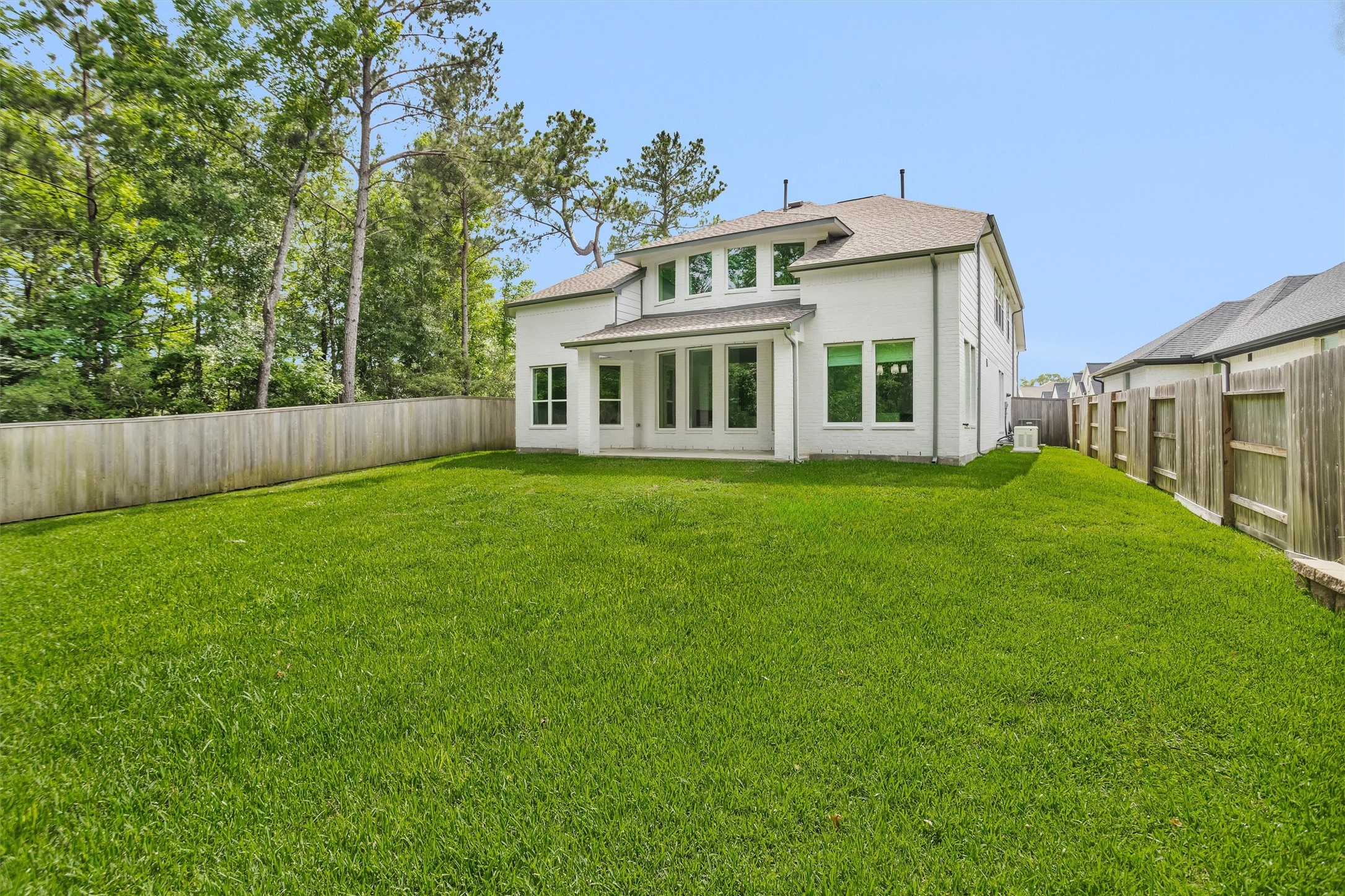 Incredible backyard retreat with endless potentialpool-ready and surrounded by wooded privacy on both sides, creating a rare setting for a future outdoor oasis immersed in nature.