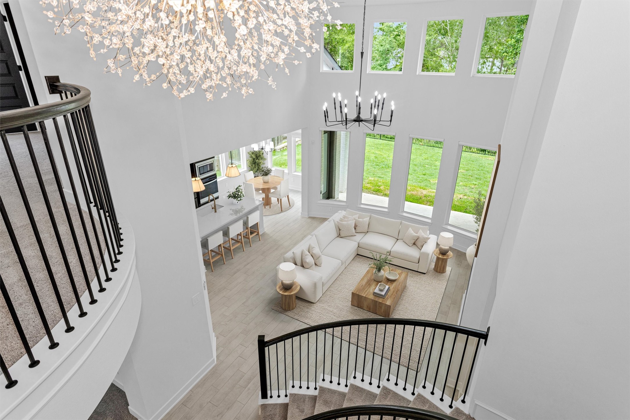 Take in this stunning view from the top of the stairs overlooking the living room, kitchen, and breakfast areashowcasing the homes open-concept design, soaring ceilings, and beautiful flow for everyday living and entertaining. Private view with no back neighbors! Take in this stunning view from the top of the stairs overlooking the living room, kitchen, and breakfast areashowcasing the homes open-concept design, soaring ceilings, and beautiful flow for everyday living and entertaining. Private view with no back neighbors!