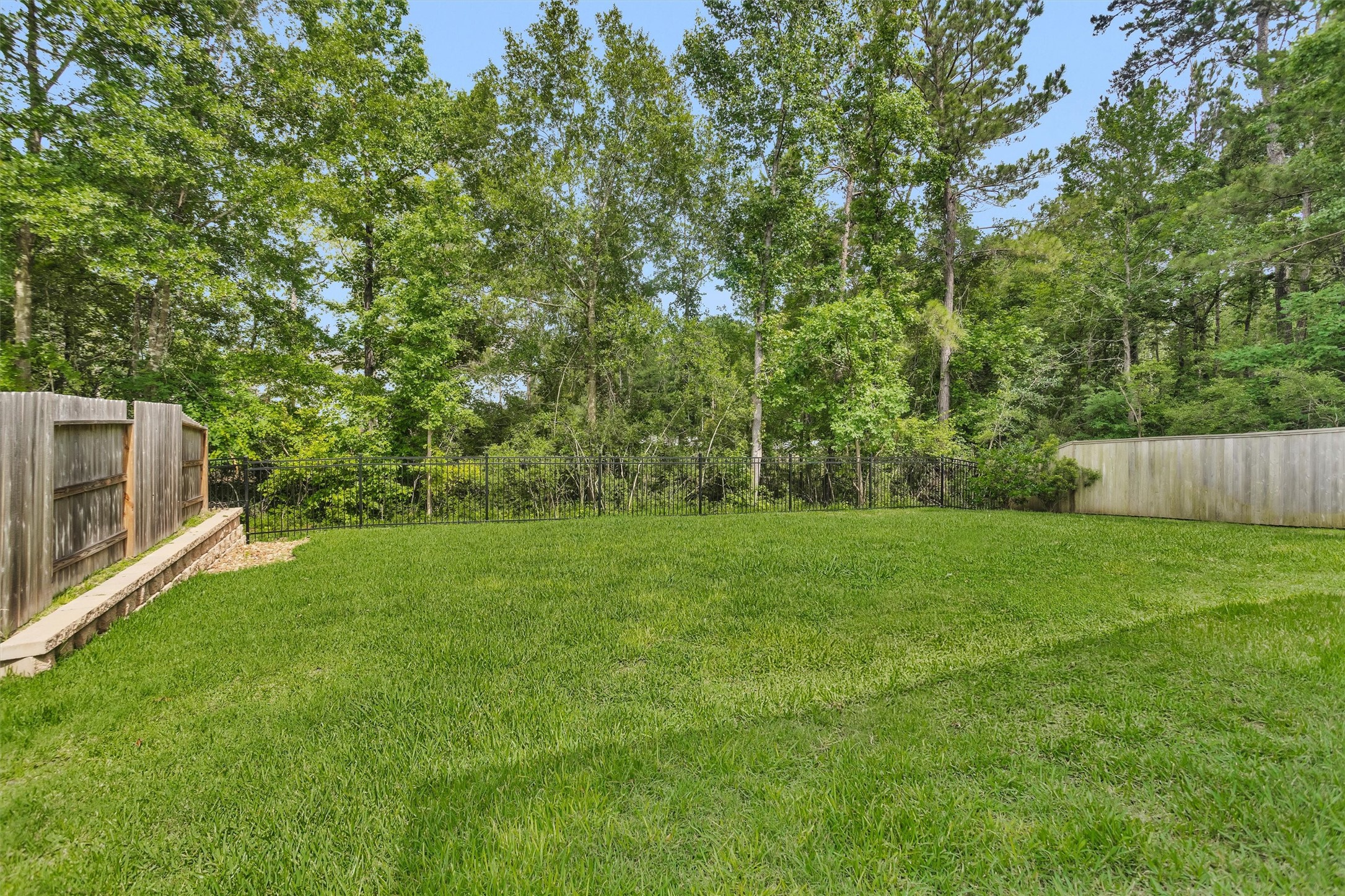 Peaceful backyard views enjoyed from the living room, breakfast area, kitchen, and primary bedroomcreating a seamless connection to nature and a serene backdrop throughout the home. Peaceful backyard views enjoyed from the living room, breakfast area, kitchen, and primary bedroomcreating a seamless connection to nature and a serene backdrop throughout the home.