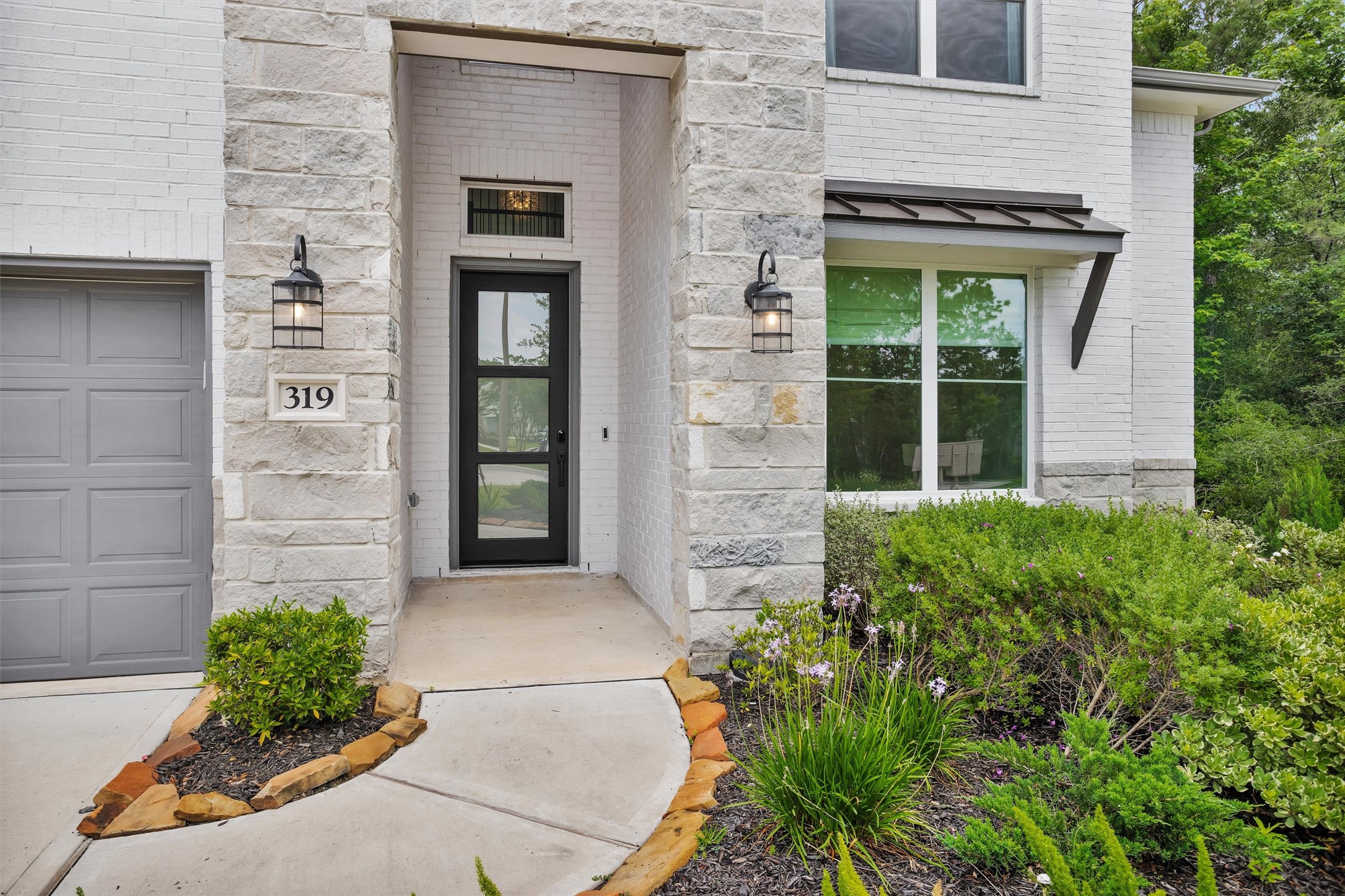Beautifully appointed exterior with upgraded stone, brick, and stucco elevation, blending timeless architecture with sophisticated curb appeal and an impressive first impression.