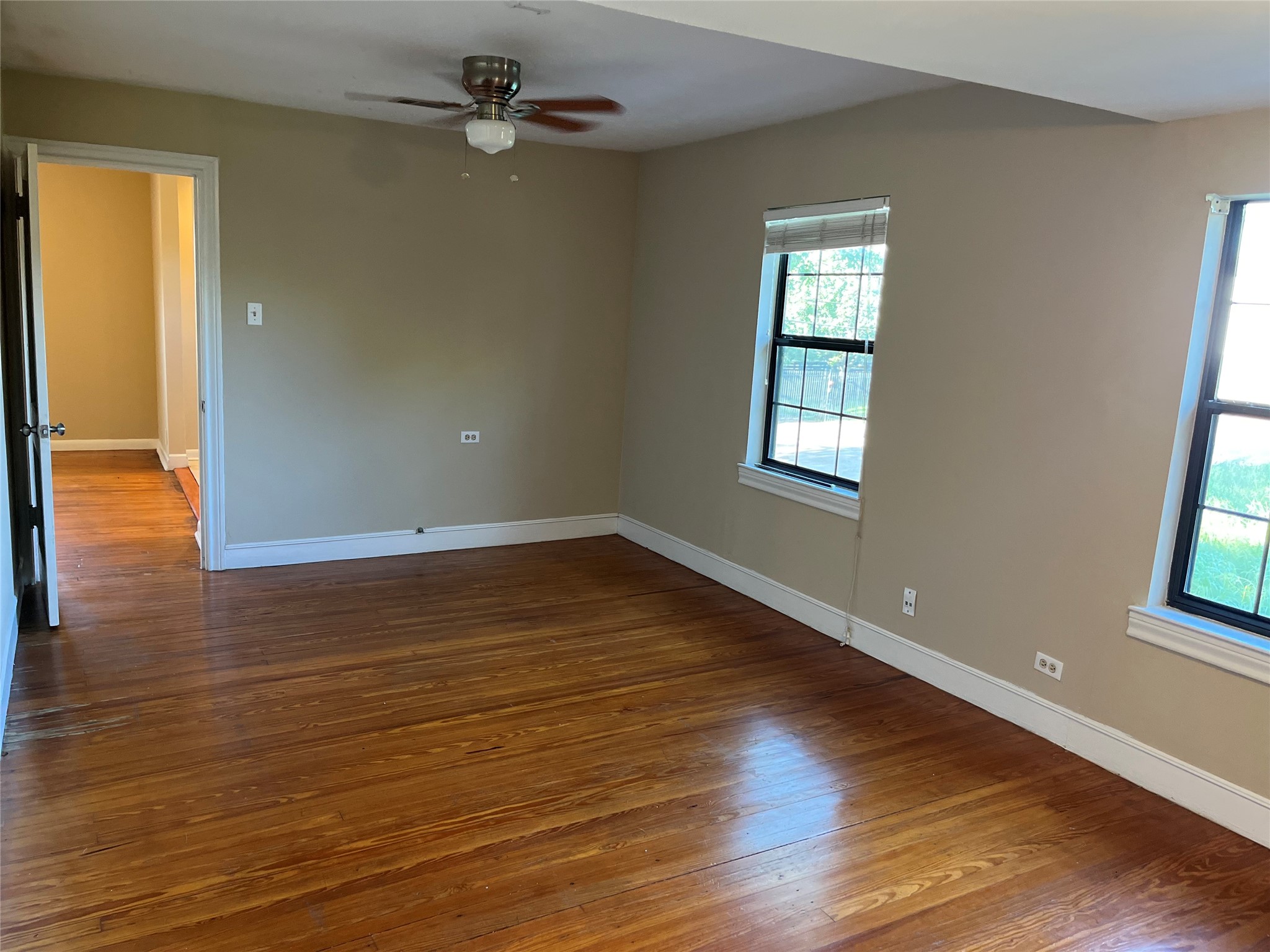 Bedroom #2 is generously sized with an abundance of natural light, closet space, and ceiling fan.
